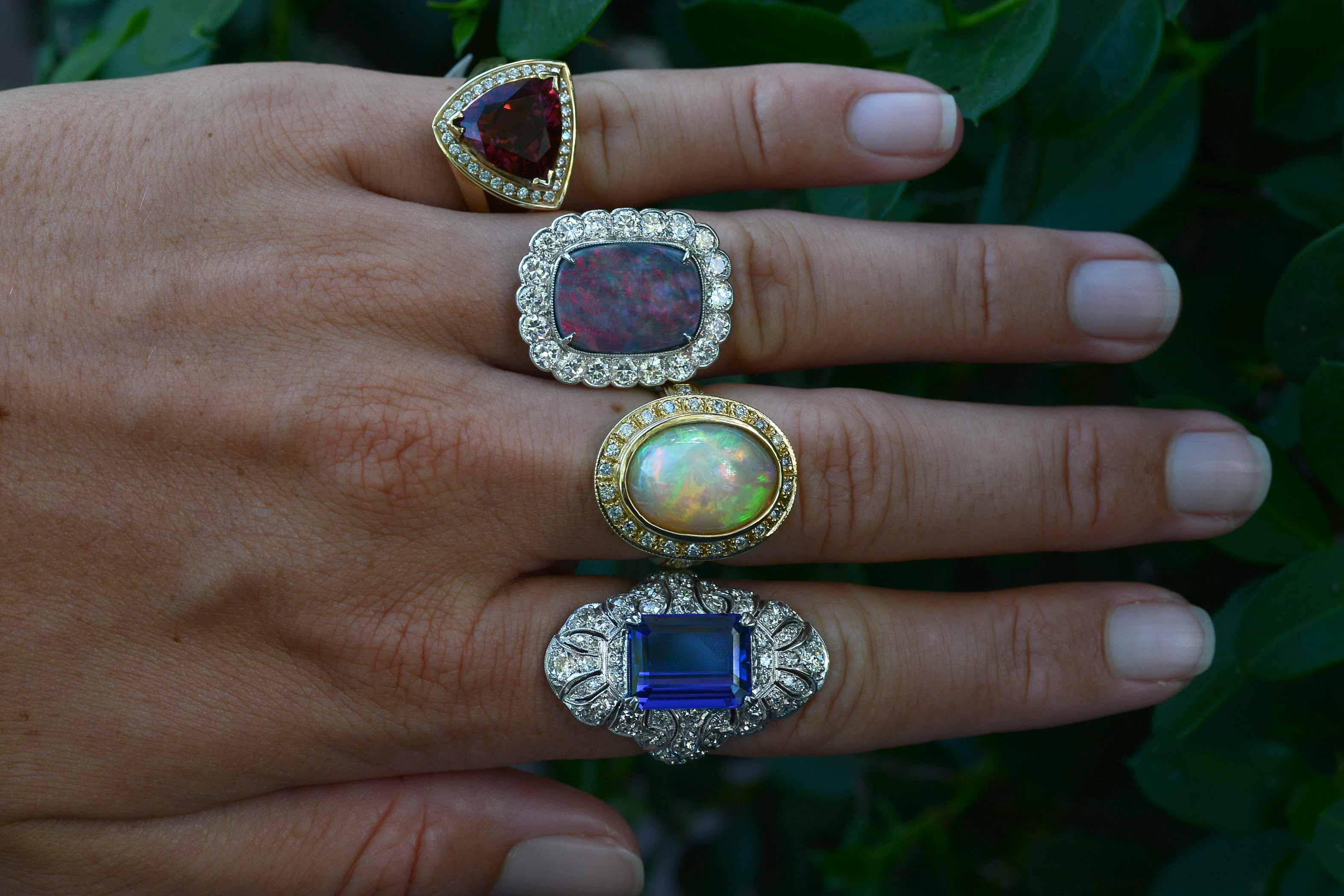 A most amazing 1930s vintage cocktail ring that is a knockout! This certified Black Opal from the famed Lightning Ridge, Australia mine displays a wonderfully strong play-of-color with rolling flashes displaying intense red, yellow, green and blue