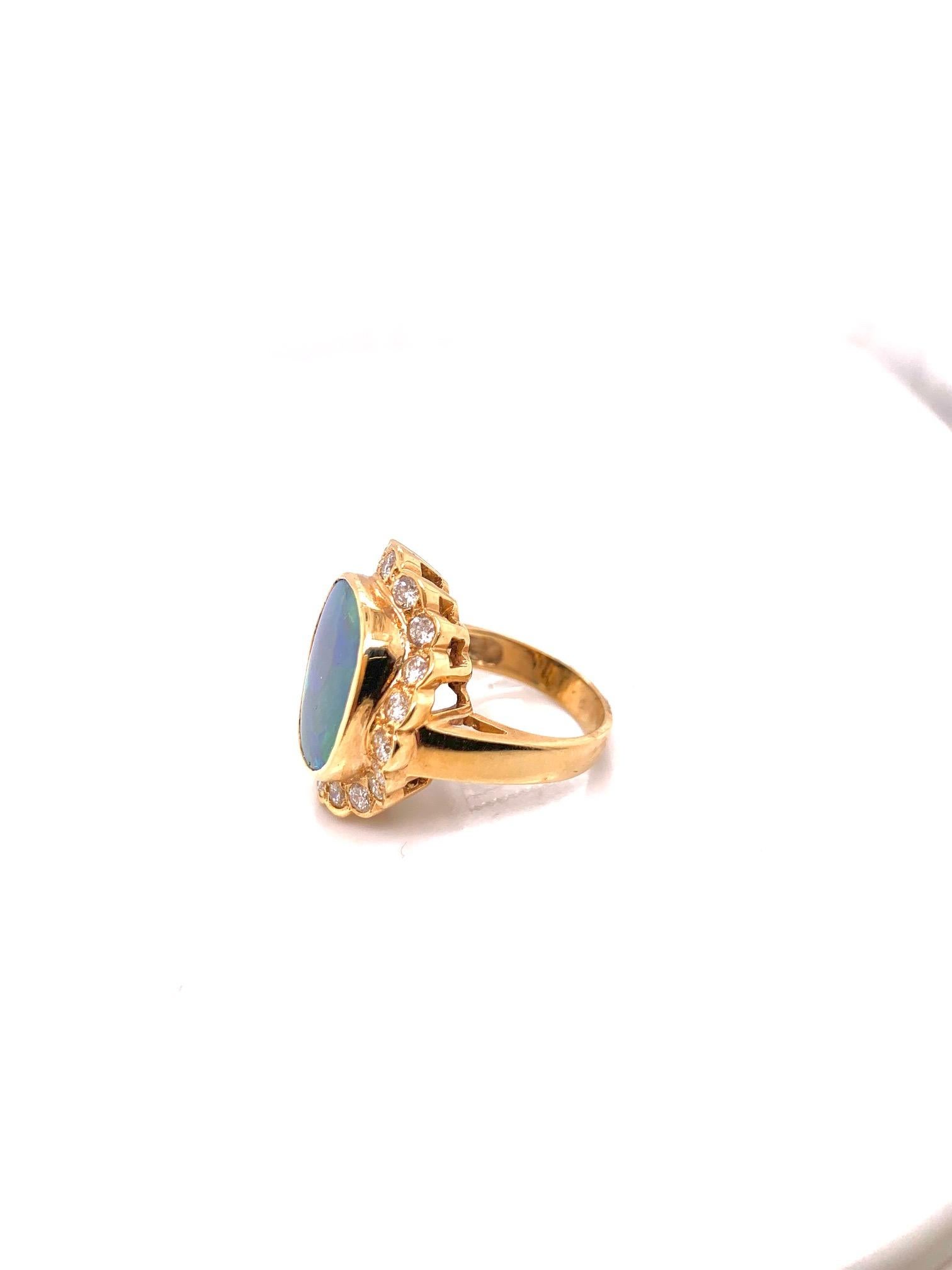 Phenomenal Black Opal and Diamond Ring 

Stones: Natural Black Opal 
Stone Dimensions: 13.3x15.5mm
Stones: Diamond
Stone Clarity: VS/SI Clarity
Stones: 20 Round Diamonds 
Stone Carat Weight: 1.01 Carat 
Material: 14K Yellow 


