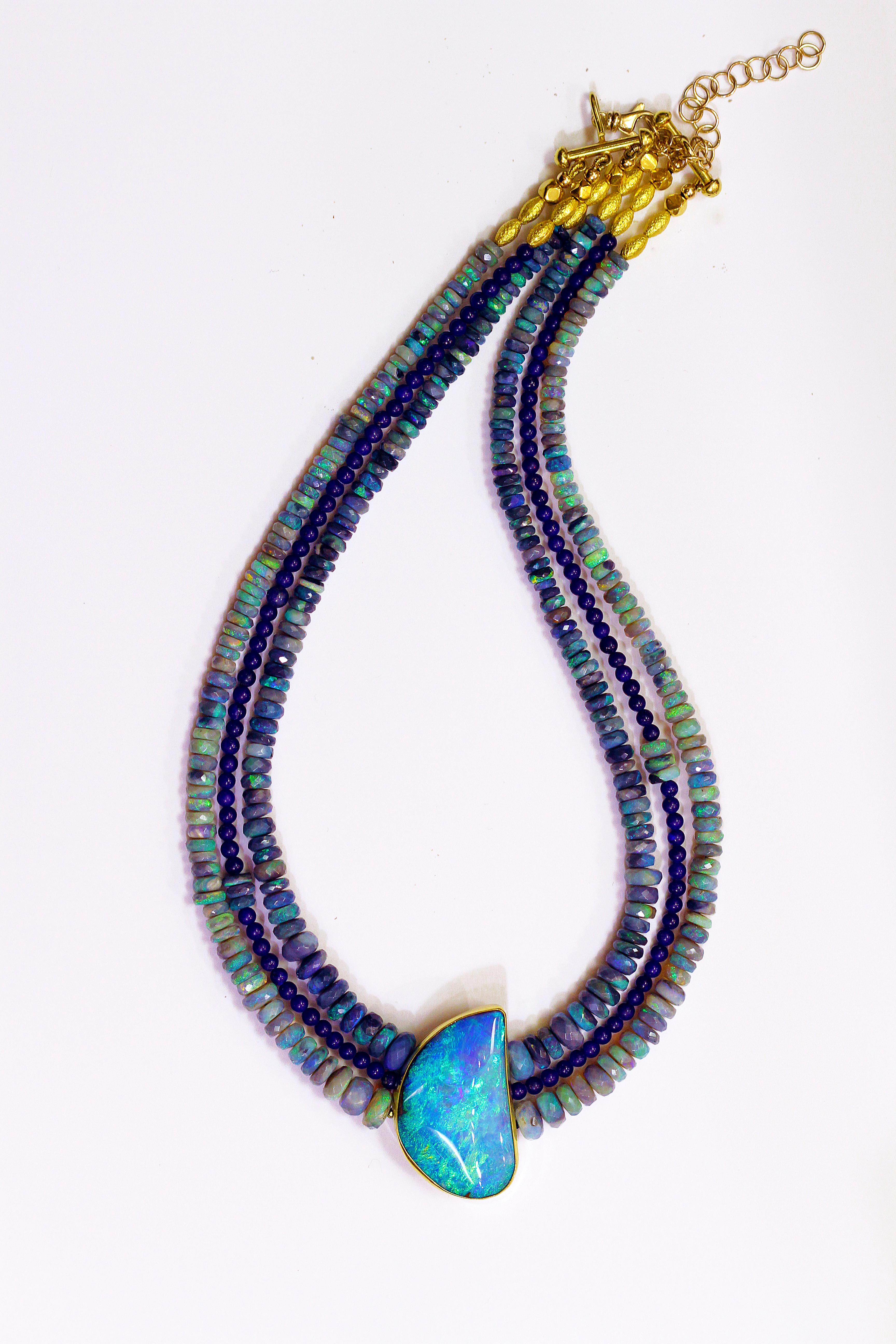 Black opal & boulder opal necklace with 18k gold spacers.  The color in the boulder opal has exquisite blue and green shades and sit's very well with these luscious black opal beads and lapis beads.  Truly a show stopper!  Black opal comes from New