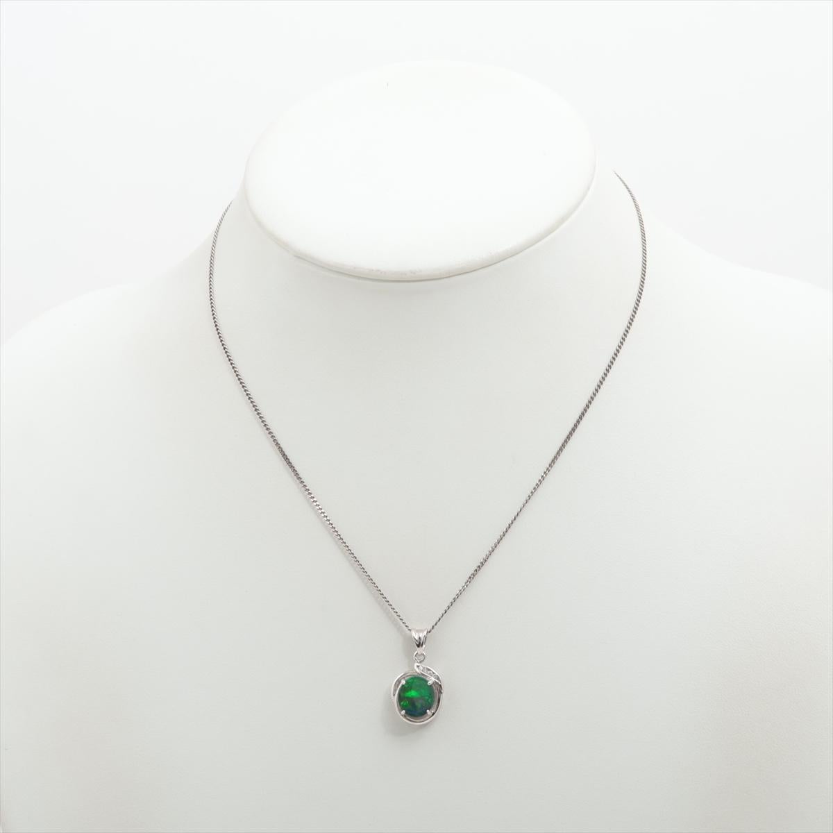 Stunning Australian Black Opal Oval Cabochon

Halo pendant with accent diamonds on top.

Stunning for any occasion.

Platinum Pt900 pendant, Chain Necklace is PT850 Platinum.

Details:
9mm by 10mm Genuine Australian Black Opal
1mm Diamonds,