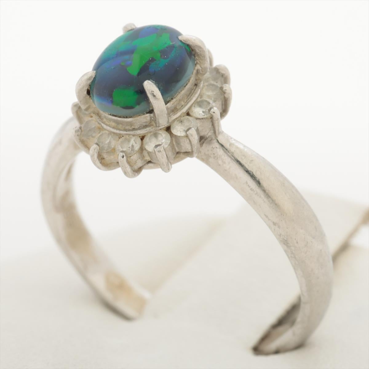 Stunning Australian Black Opal Oval Cabochon

Halo design ring with Diamond accents.

Stunning for any occasion - Perfect Engagement or Promise ring.

Platinum Pt900

Details:
6mm by 7mm --- 0.83ct Natural Australian Black Opal.
0.23ctw of