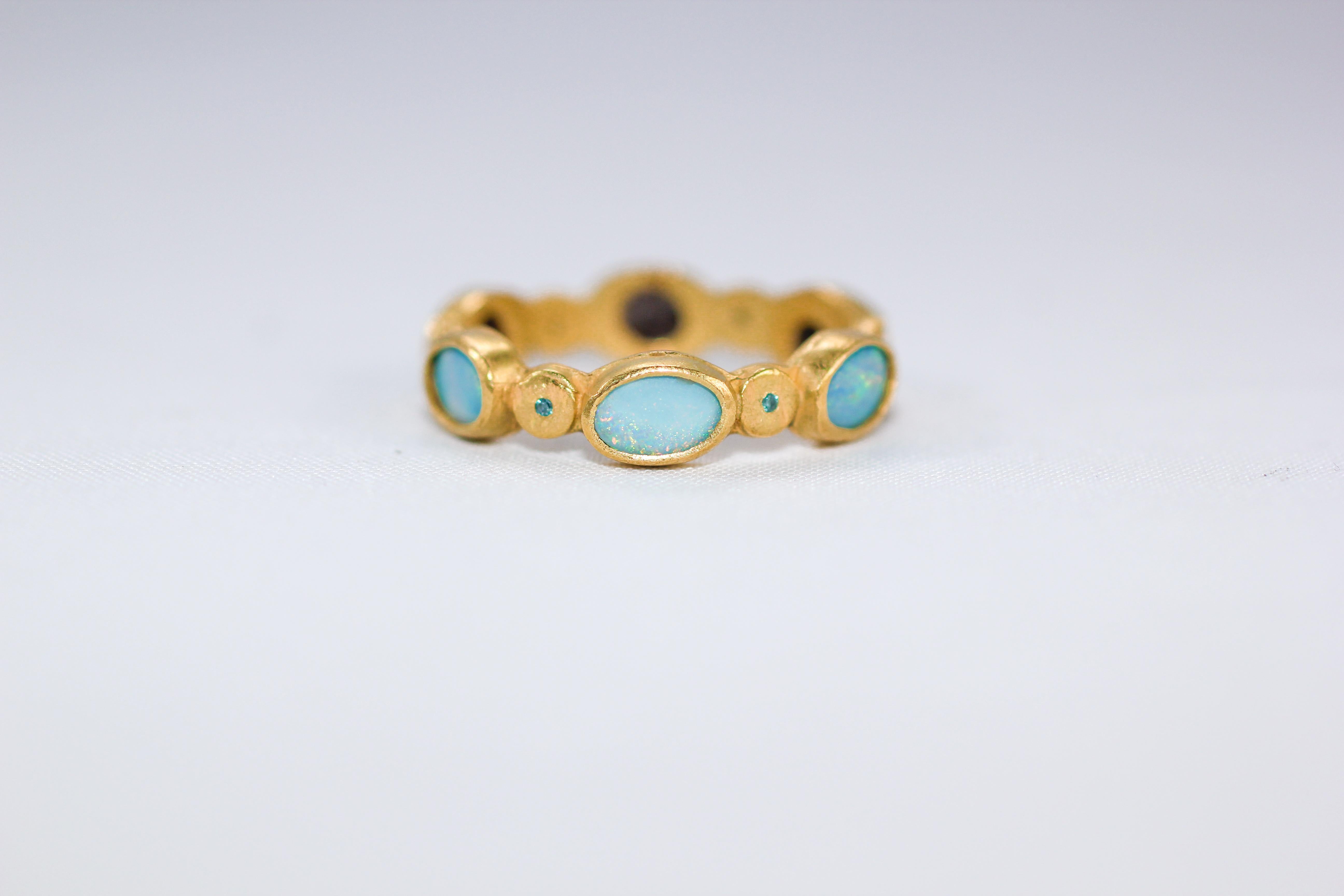1001 Night: ring #4. One-of-a-kind handmade 18K gold fashion band ring. Rich and exotic Black Opals are bezels set in solid 18k yellow gold and accented with color diamonds, pink sapphire, and Tsavorite garnet creating a bright and interesting