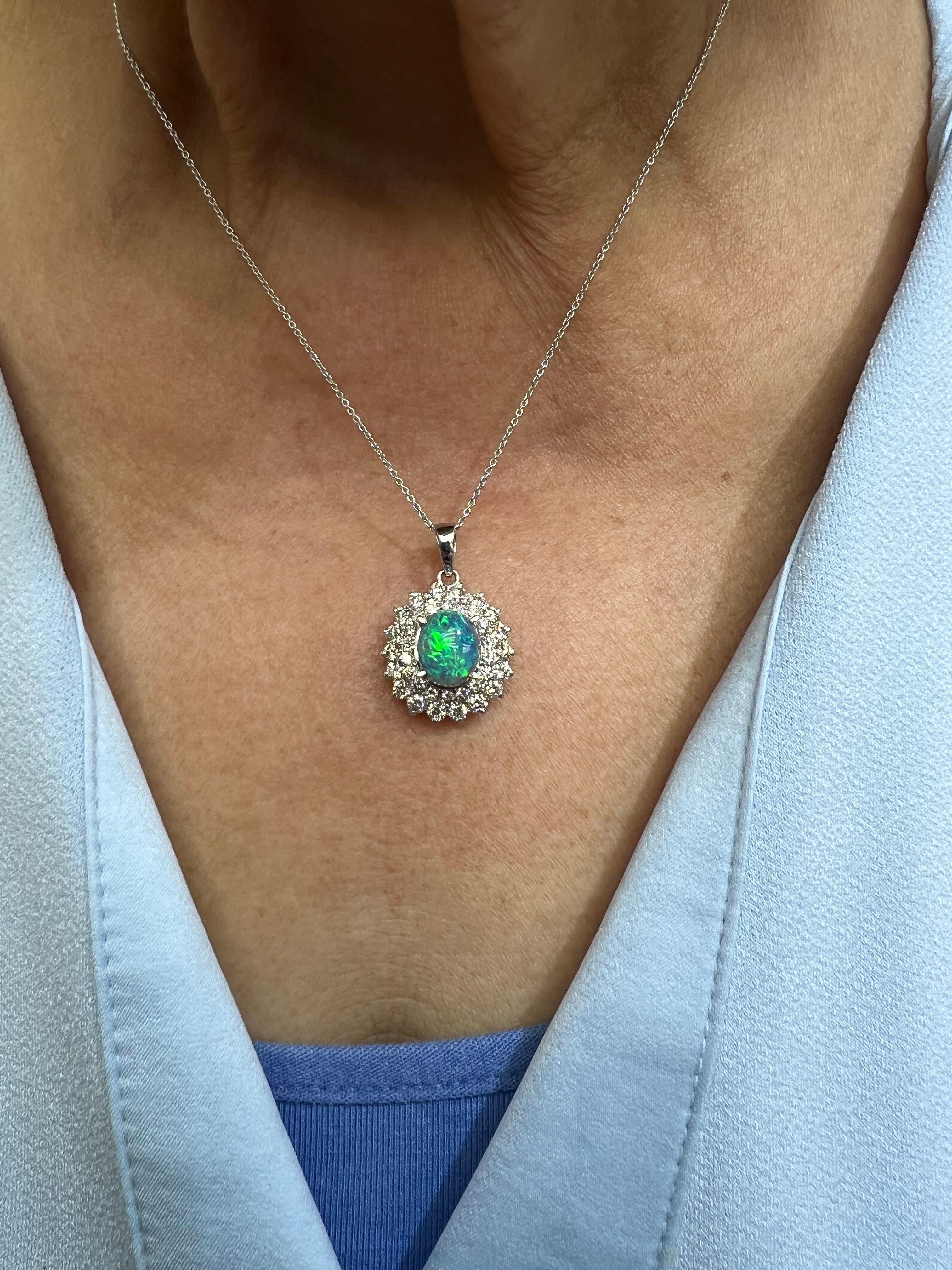 Black Opal and Diamond White Gold Pendant Necklace, circa 2000.

The Black Opal and Diamond White Gold Pendant Necklace from around 2000 is a very special piece.  The Black Opal's colors of Green and Blue are quite vibrant. And the opal is
