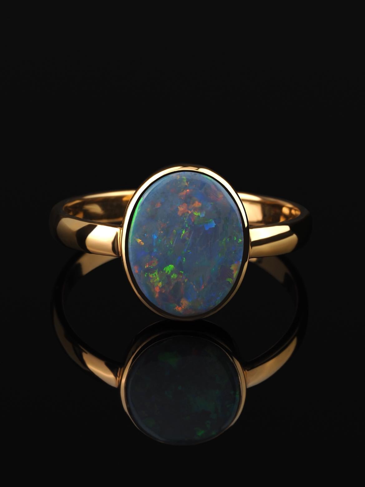 Anillo de oro de 18 quilates con ópalo negro
origen del ópalo - Australia 
medidas de la piedra - 0,12 х 0,31 х 0,43 in / 3 х 8 х 11 mm
peso del ópalo - 1,65 quilates
peso del anillo - 2,72 gramos
talla del anillo - US 8 / EU 57 / UK P½ / 18.1