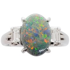 Black Opal Oval and White Diamond Emerald Cut Ring in Platinum