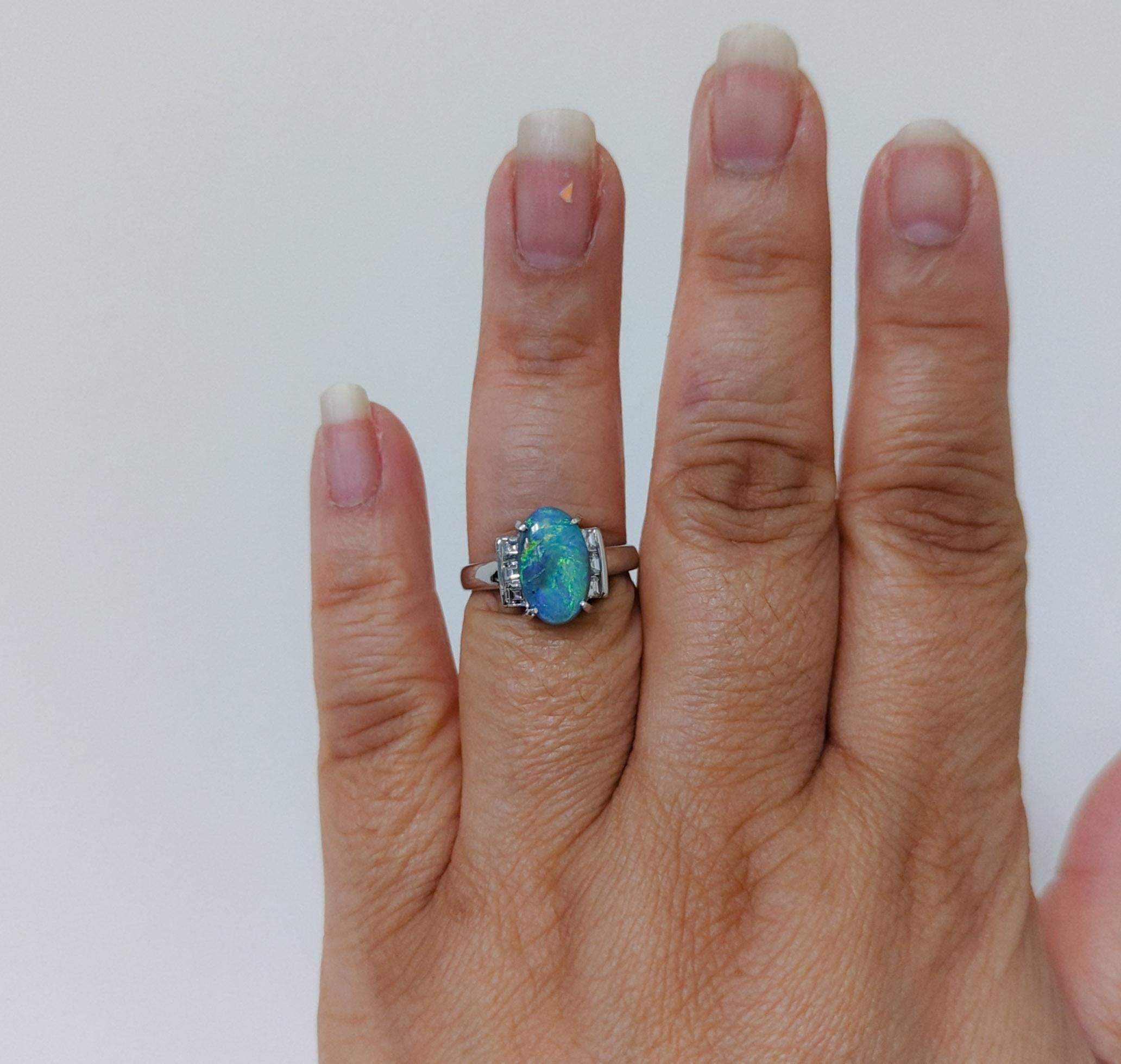 Beautiful 2.55 ct. black opal oval with 0.64 ct. good quality white diamond squares.  Handmade in platinum.  Ring size 5.5.