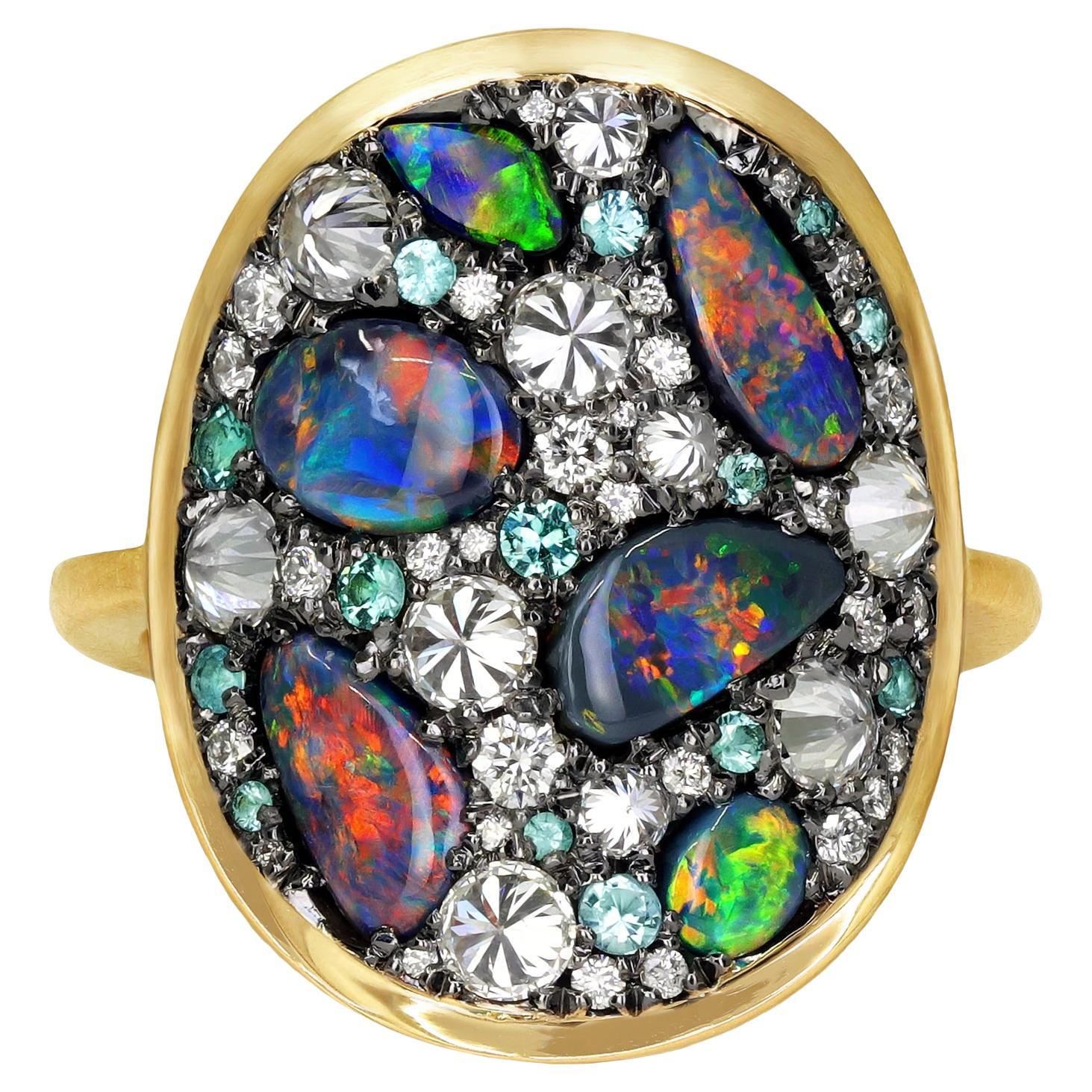 One of a kind Starstruck Ring handmade in Belgium by jewelry artist Joke Quick in matte-finished 18k yellow gold and blackened sterling silver featuring six exceptionally-fine quality Australian lightning ridge black opal cabochons totaling 2.01
