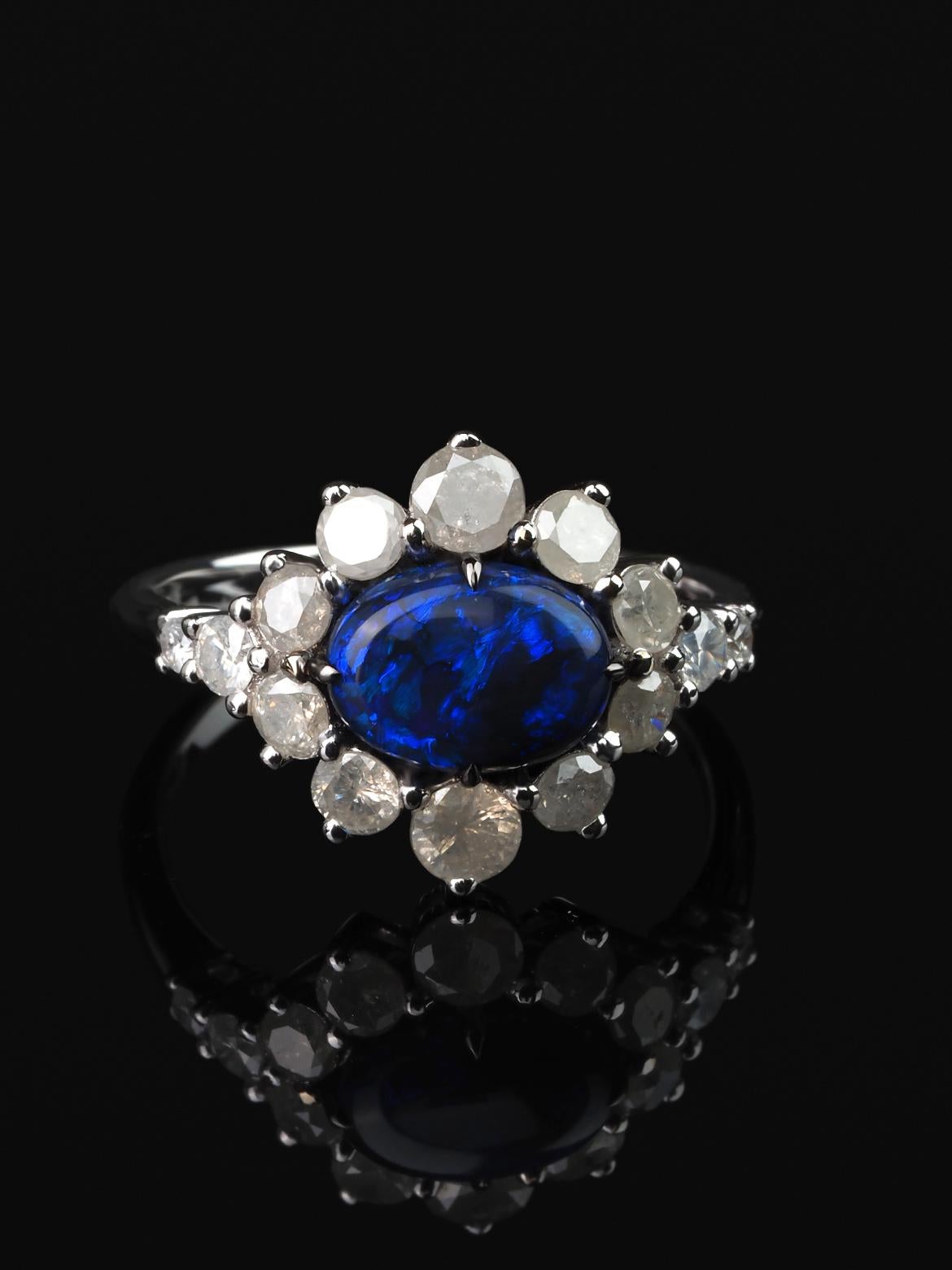 18K white gold ring with natural Black Opal and White Icy Diamonds
opal origin - Australia
opal measurements - 0.28 х 0.35 in / 7 х 9 mm
stone weight - 2.70 carats
14 diamonds 2.5-3.5 mm
ring weight - 4.45 grams
ring size - 7.5 US 


We ship our