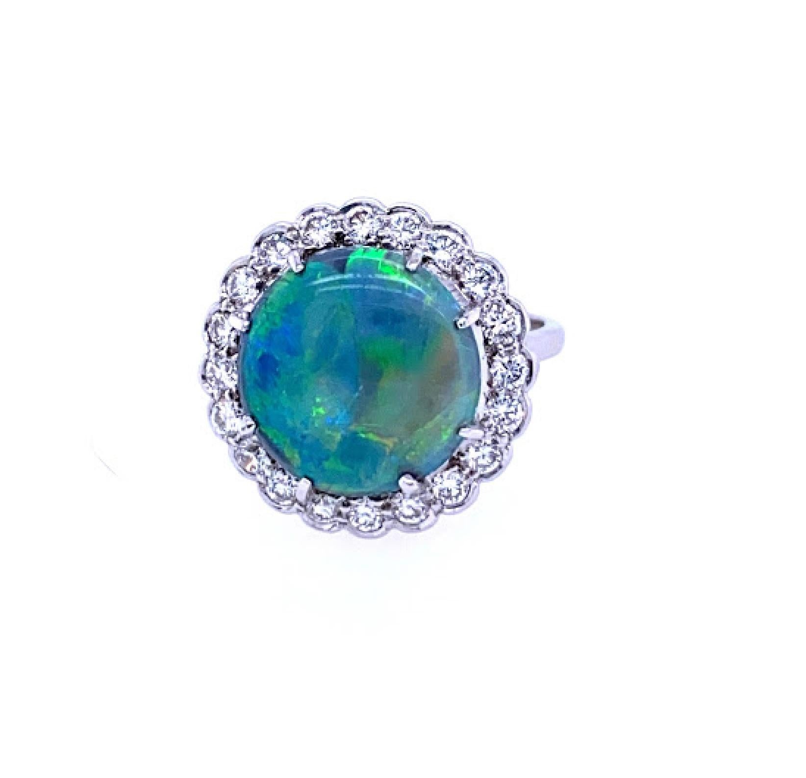 18 karat white gold (stamped 750) ring featuring a 14 mm round black opal ring. The ring’s halo contains 20 round brilliant diamonds weighing approximately 1.00 carat total weight, and the diamonds are in the G/H color range and the VS clarity