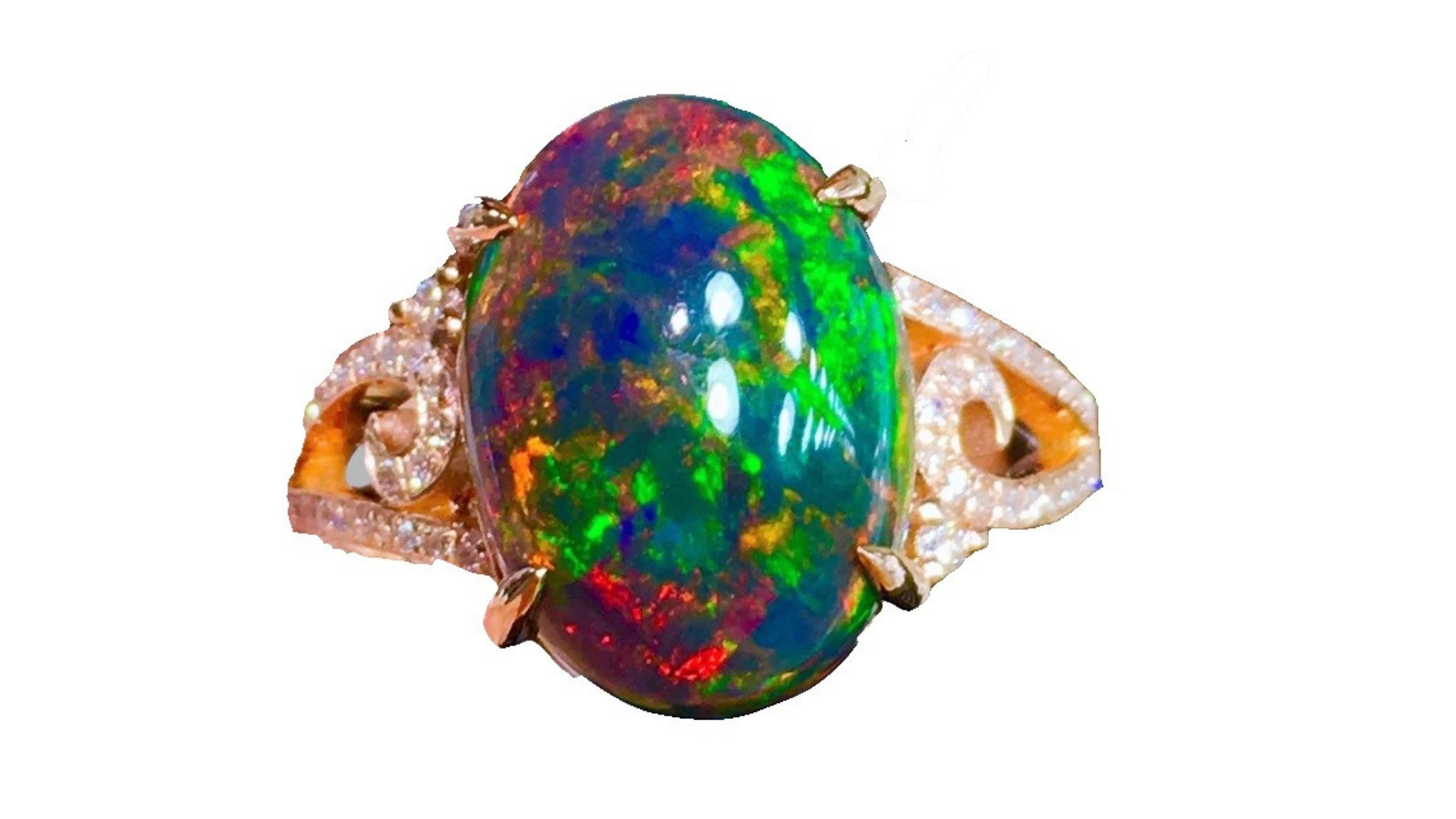 This Black Ethiopian Ring with 38 White Diamonds really stands out as it shows off very bright colors  Blue Green Orange Yellow Red 

Precious opal mined in Ethiopia began entering the gem and jewelry market in 1994. This opal originated from a