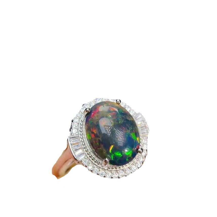 
This Black Opal Shows Bright Colors Green Blue with Yellow Purple Red with accent  and can be be in Yellow  or Rose or white gold plated  too . 
The Ethiopian Opal resourced from the Wollo Province of northern Ethiopia. The beautiful opals from