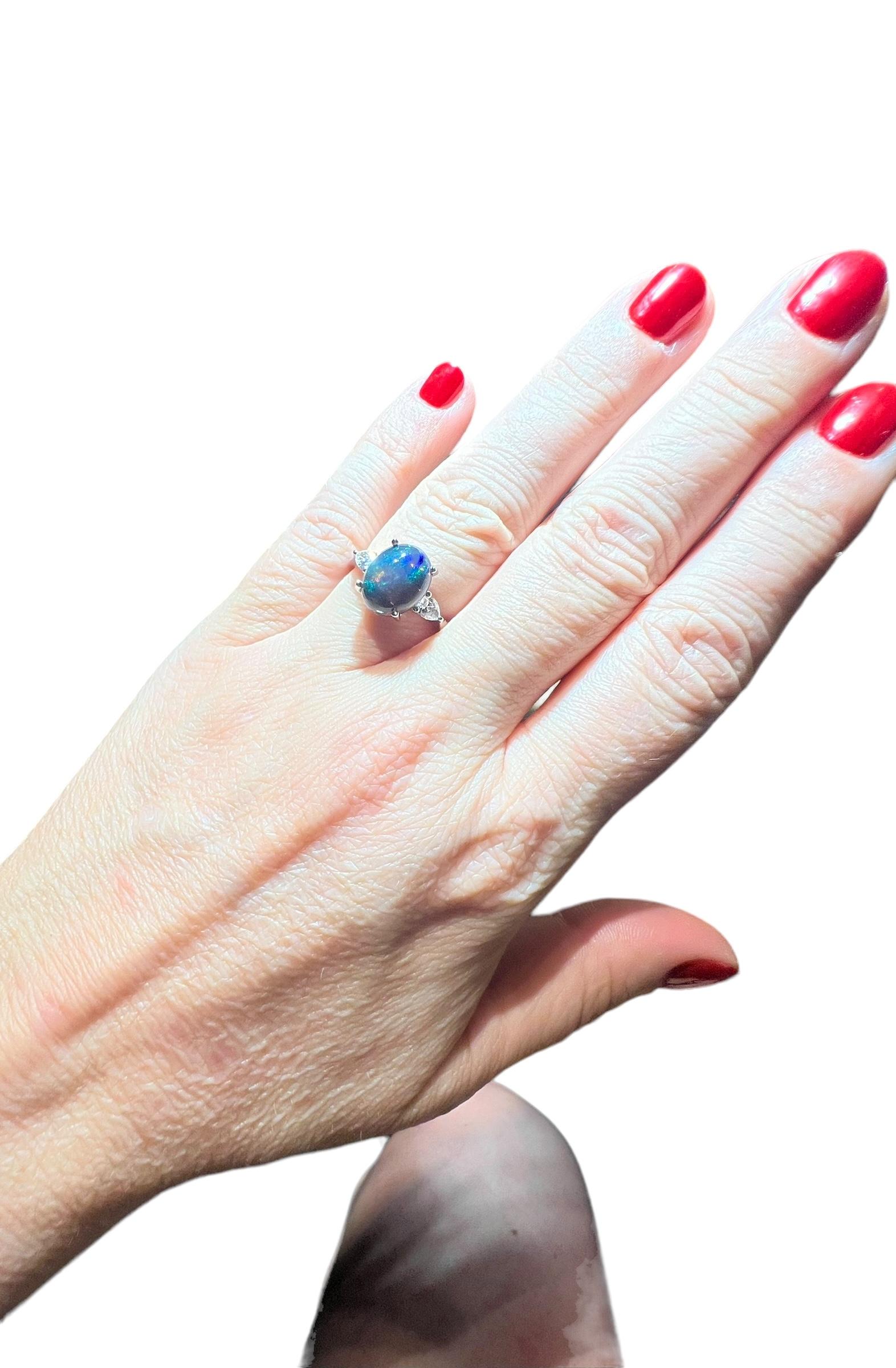 Art Deco Black Opal ring surrounded by 2 pears 18 carat white gold diamond For Sale