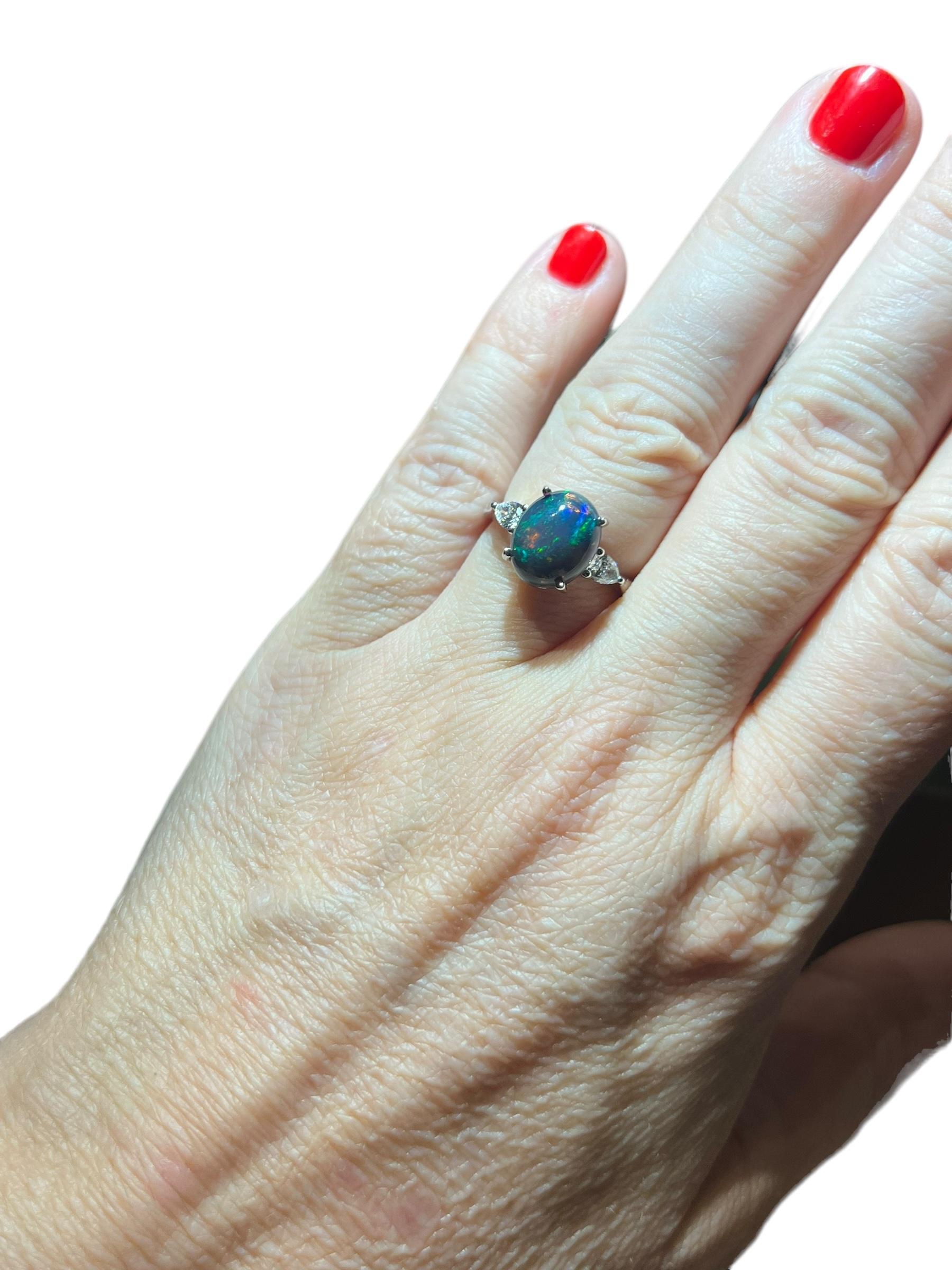 Pear Cut Black Opal ring surrounded by 2 pears 18 carat white gold diamond For Sale