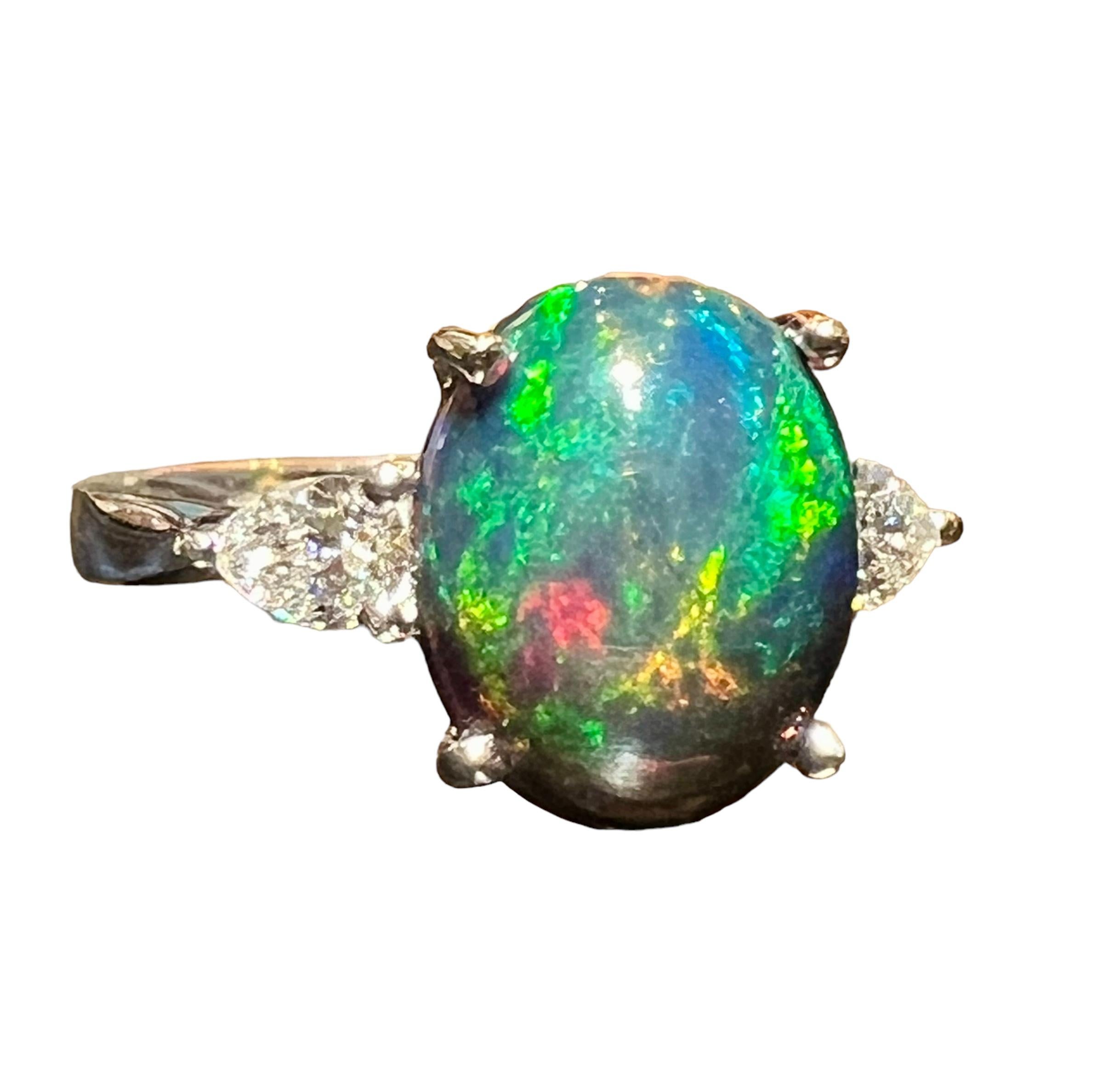 Black Opal ring surrounded by 2 pears 18 carat white gold diamond For Sale 3