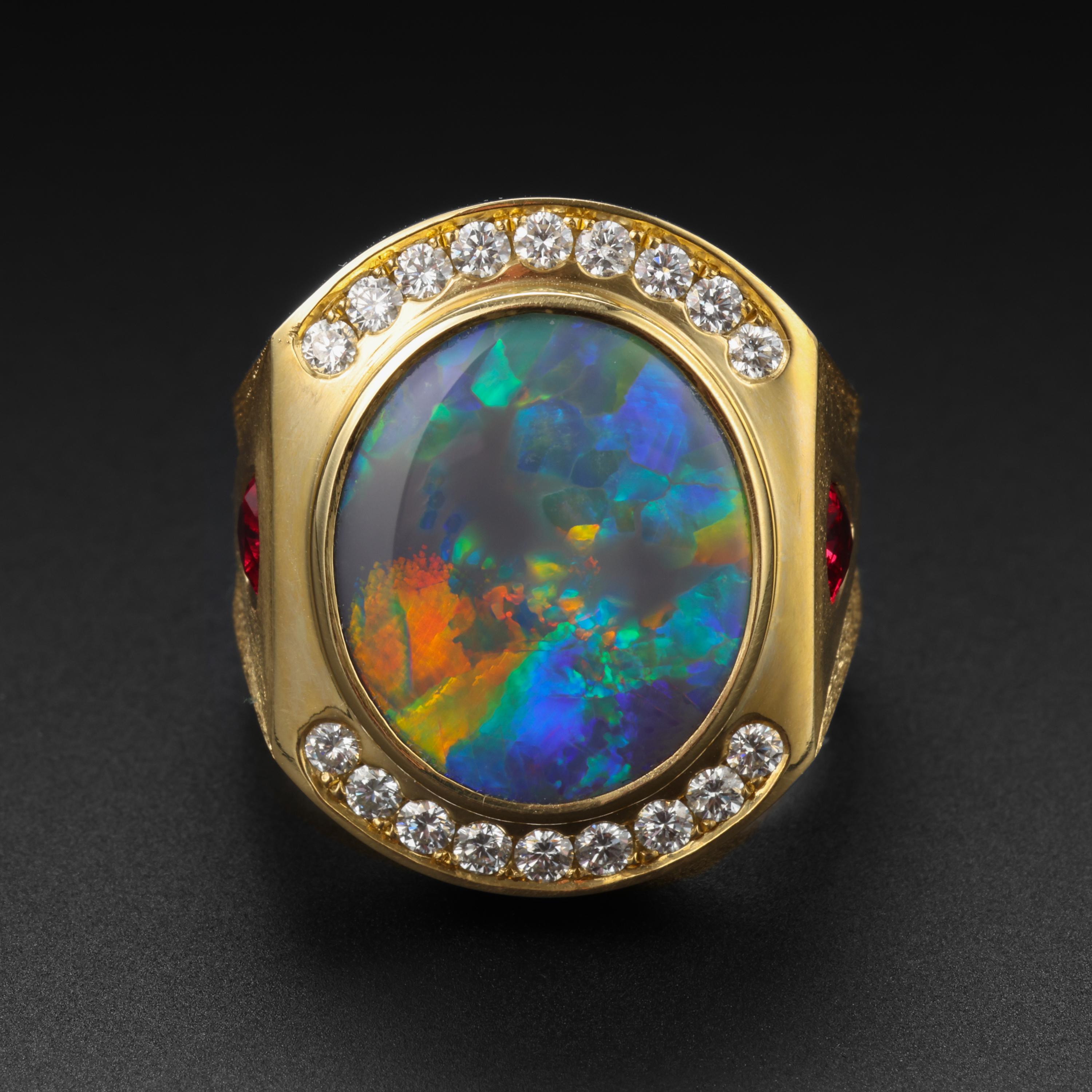 The finest solid black opal from Australia's legendary Lightning Ridge mine, aflame with vivid red and orange -the rarest colors of black opal- in a swirling sea of blues, greens and yellows is the mesmerizing centerpiece of this iconic men's opal