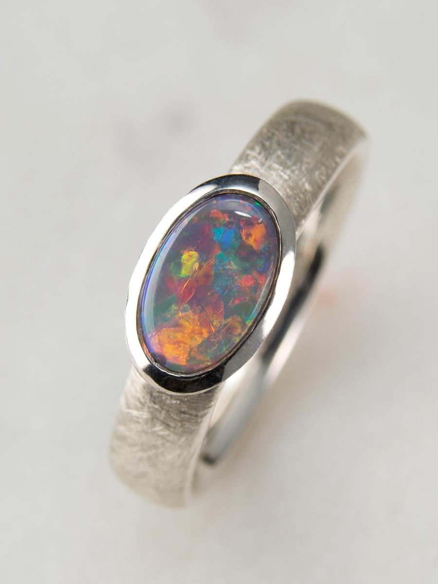 Silver ring with natural Black Opal with bright opalescence
opal origin - Australia
opal measurements - 0.2 x 0.35 in / 5 x 9 mm
stone weight - 1.5 carats
ring size - 6.5 US / 17 RU
ring weight - 4.30 grams

Scratching collection