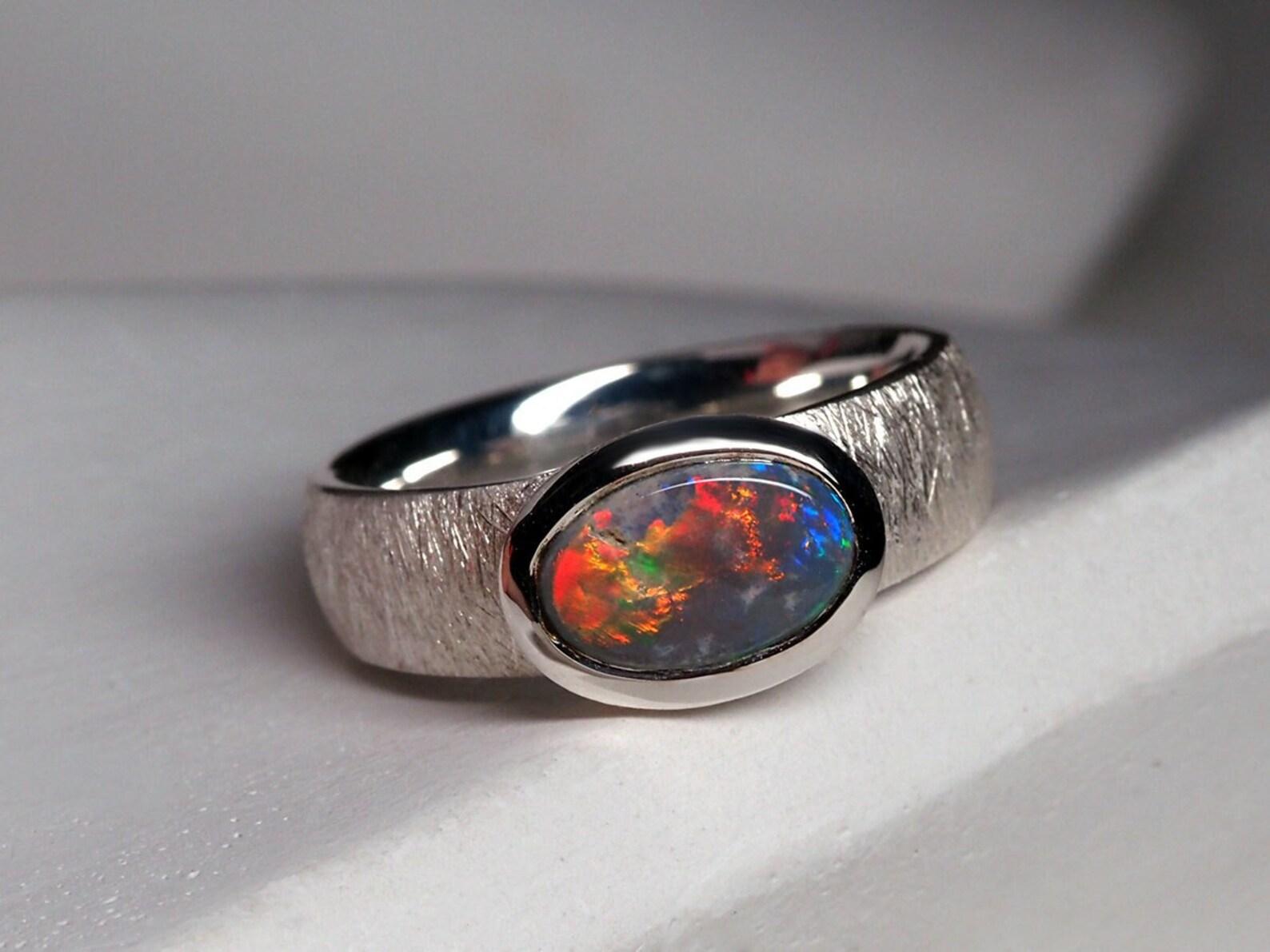 Silver ring with natural bright Black Opal
opal origin - Australia
opal measurements - 0.24 x 0.35 in / 6 x 9 mm
opal weight - 0.72 carats
ring size - 5.5 US
ring weight - 4.93 grams