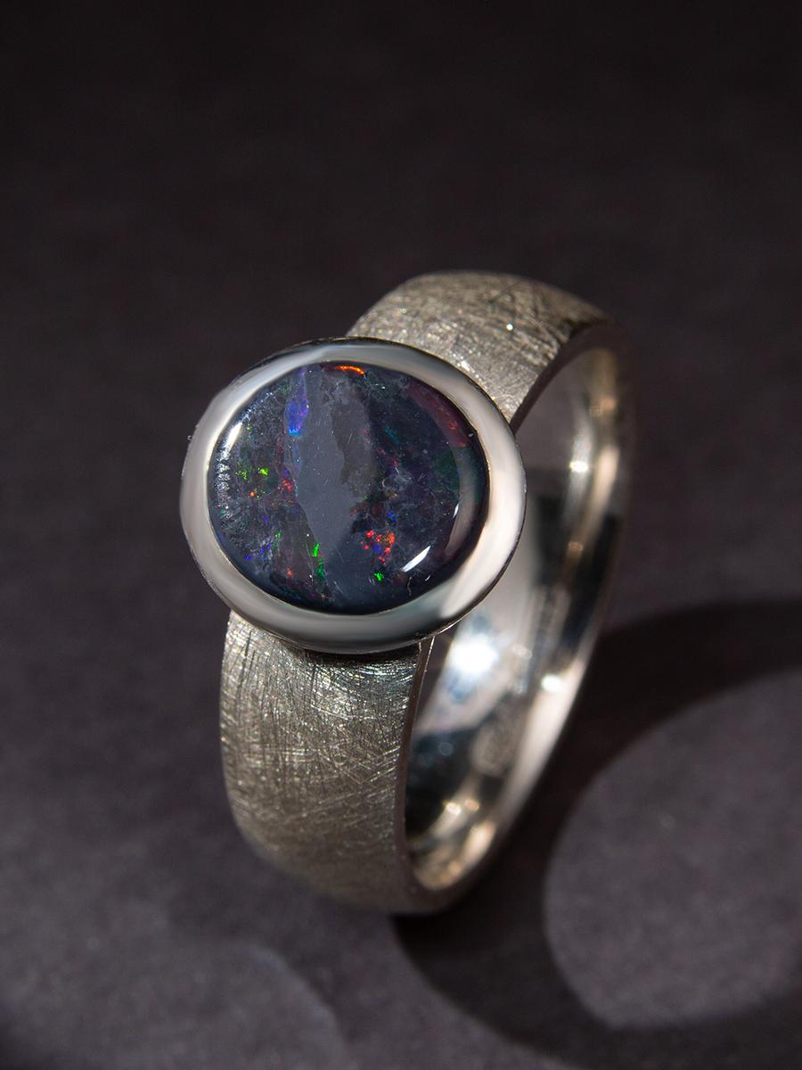 Scratched silver ring with natural Black Opal
opal origin - Australia
stone measurements - 0.31 х 0.39 in / 8 х 10 mm
stone weight - 2.5 carats
ring size - 9.25 US
ring weight - 6.54 grams

