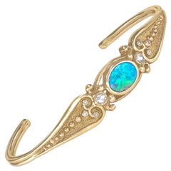 Bracciale Art Deco in oro giallo con diamante bianco e opale nero, Just Jules