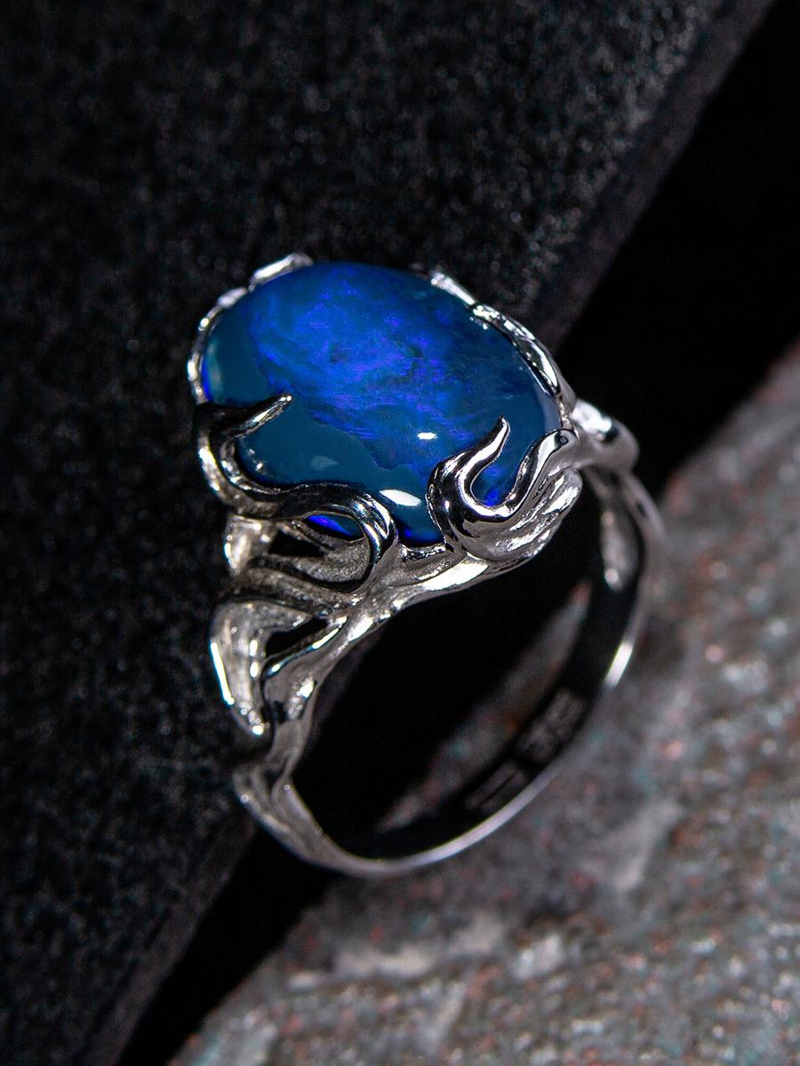 On request: Wave collection handmade 18K white gold ring with australian Dark Neon Blue Opal
opal origin - Australia
opal measurements - 0.43 х 0.63 in / 11 х 16 mm
stone weight - 7-12 carats
ring size - 5-10 US 
ring weight - 6-8 grams

Adorned