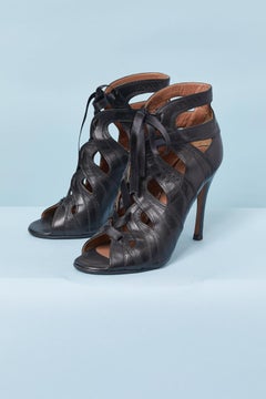 Black open-toe leather sandal with ribbon laces on the top front ALAIA