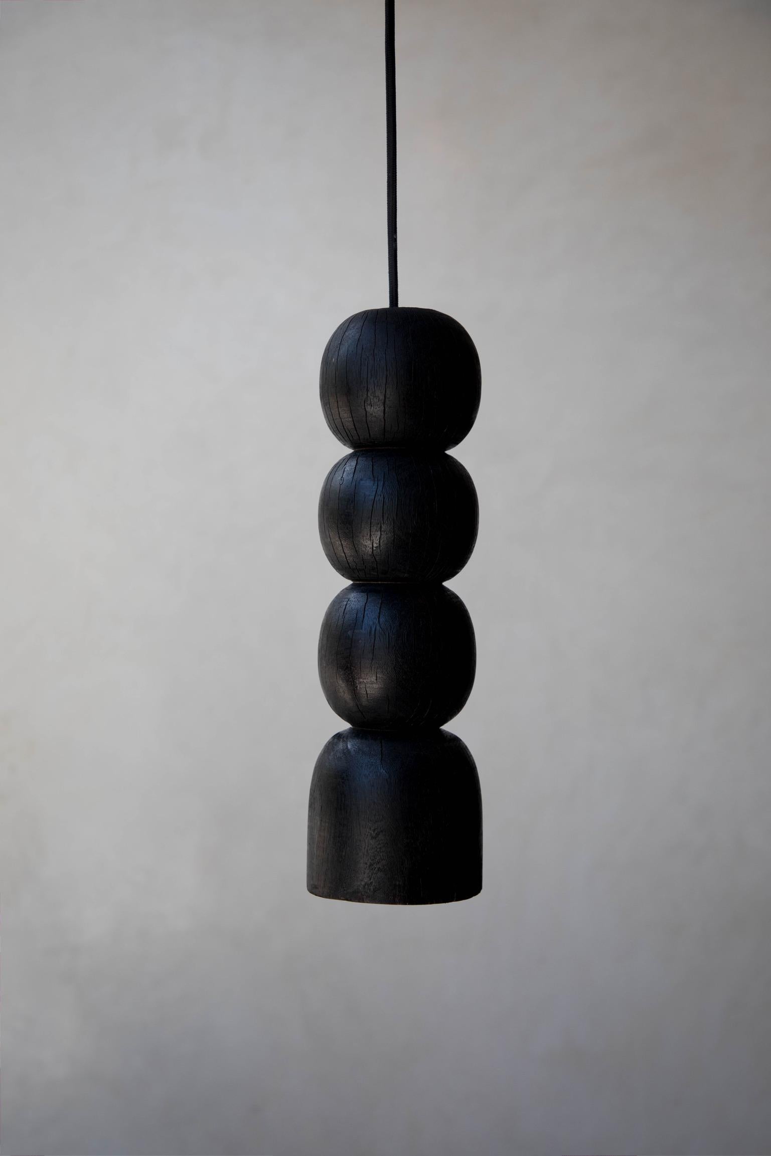 Black Original L5 wood pendant lamp by Daniel Orozco
Material: Jabin wood.
Dimensions: D 12 x H 42 cm
Available in natural or black wood finish.

Sphere hanging lamp of jabin wood, natural or black finish. Handmade by Mexican