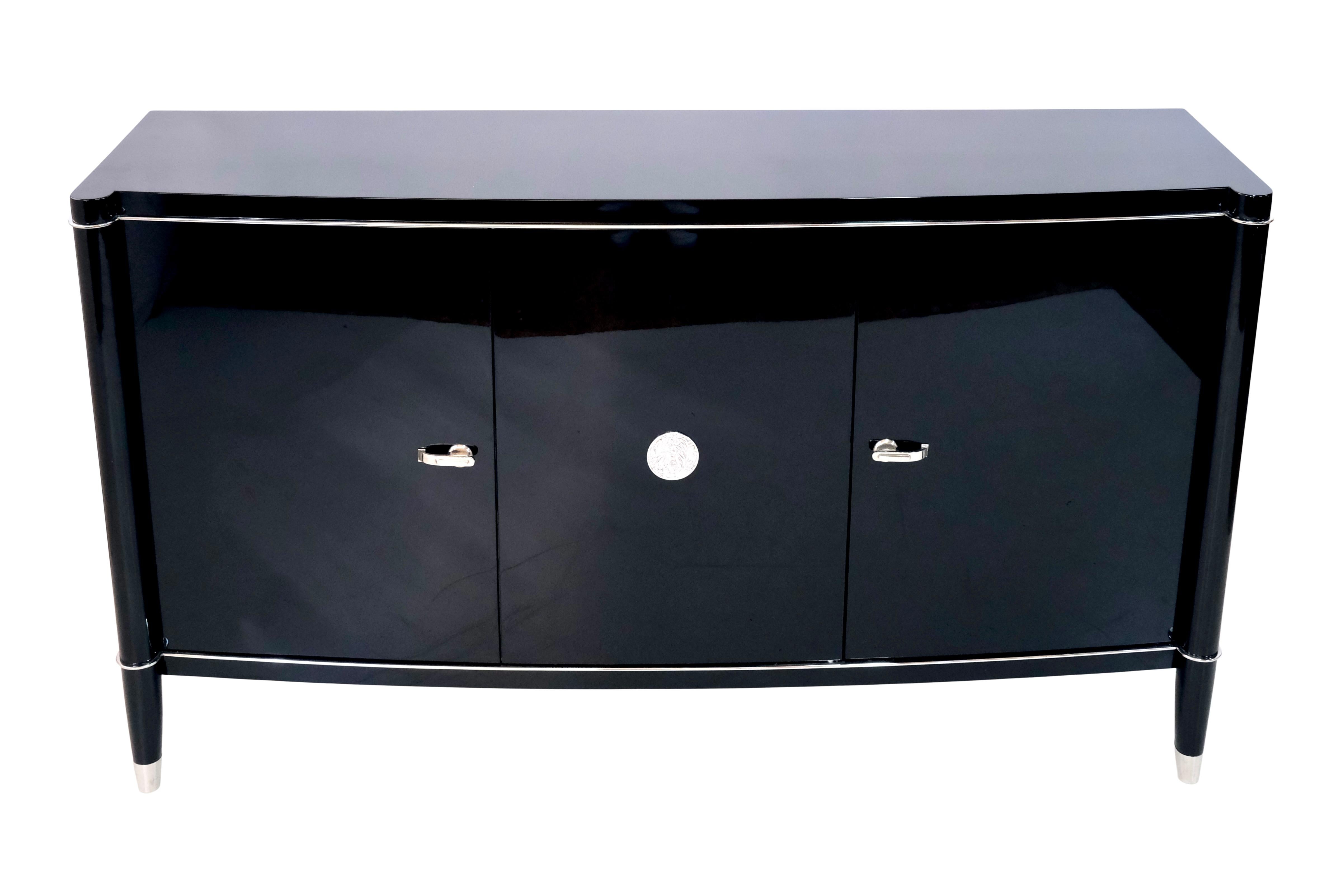 Sideboard from the Belgian Furniture Manufactory DeCoene Frères. 
Well known Art Déco Furniture, Belgium 1940s 

Fresh Black Piano Lacquer 
All Metal Applications ORIGINAL!!! Nothing added afterwords. 
Brass, nickeled

Measures: 
Width 150 cm