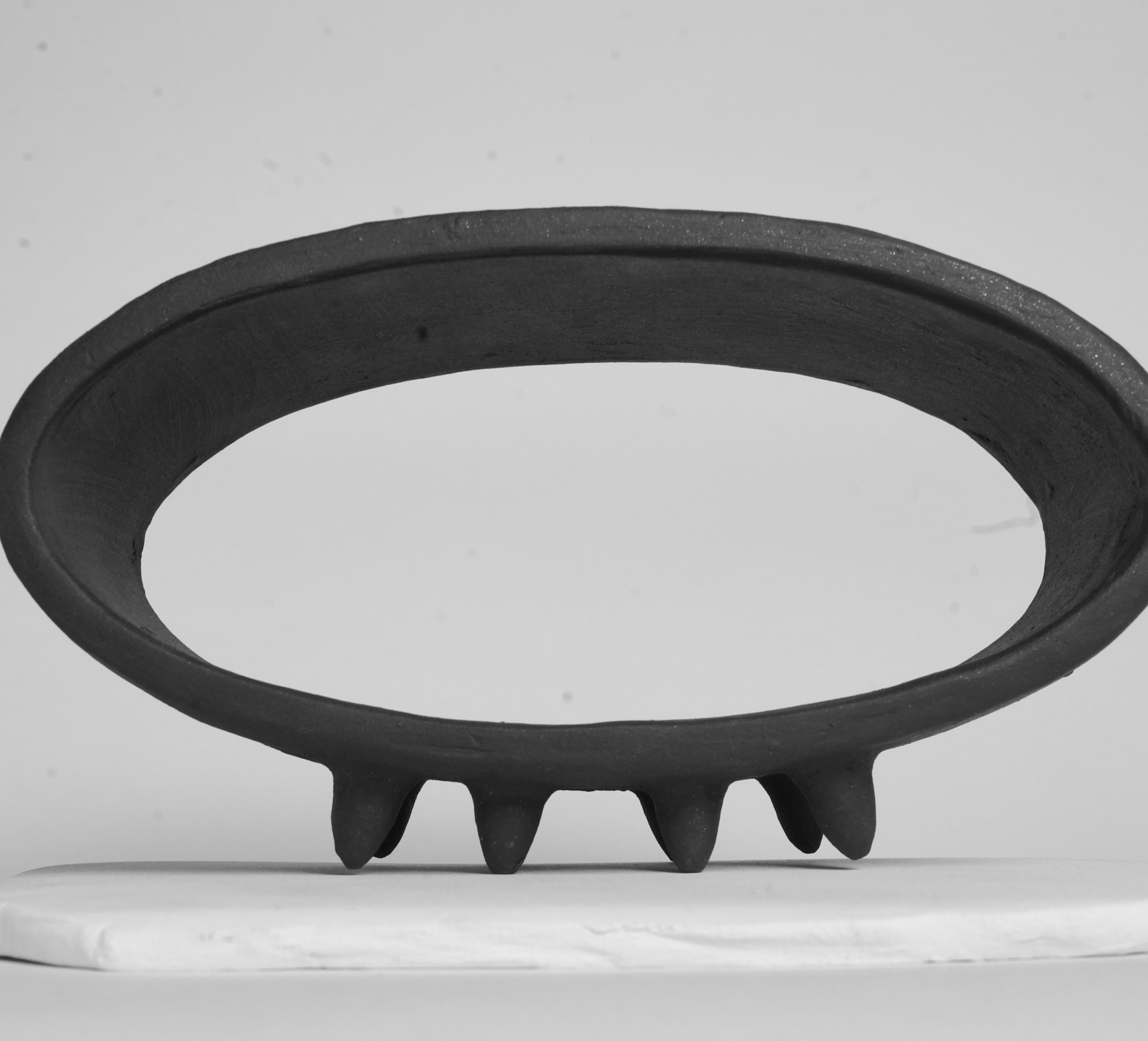 Contemporary Black Oval Ceramic Sculpture with 2 Rows of Small Pointed Feet For Sale