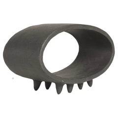 Black Oval Ceramic Sculpture with 2 Rows of Small Pointed Feet
