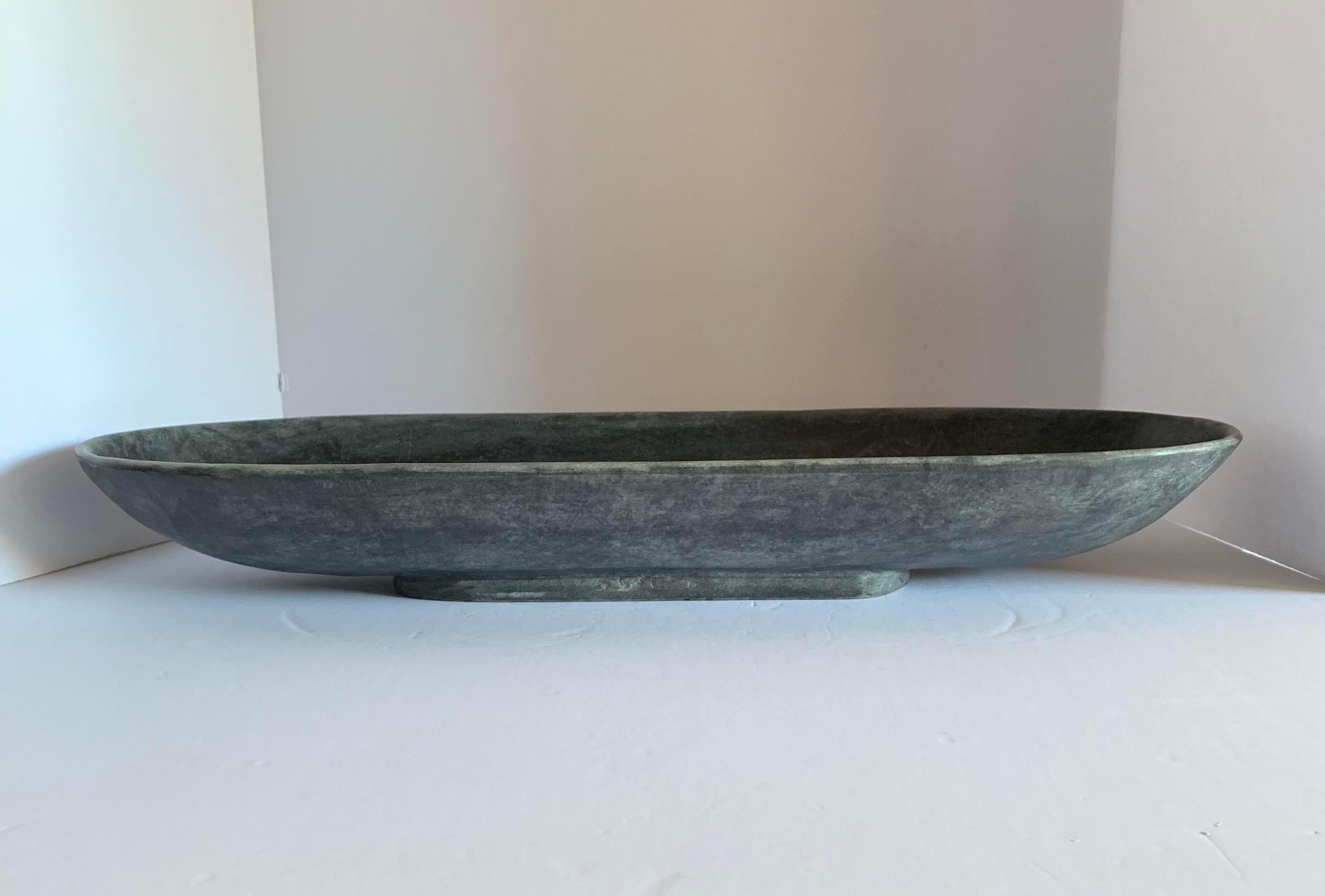 Contemporary Chinese long oval shaped black marble tray.

  
        