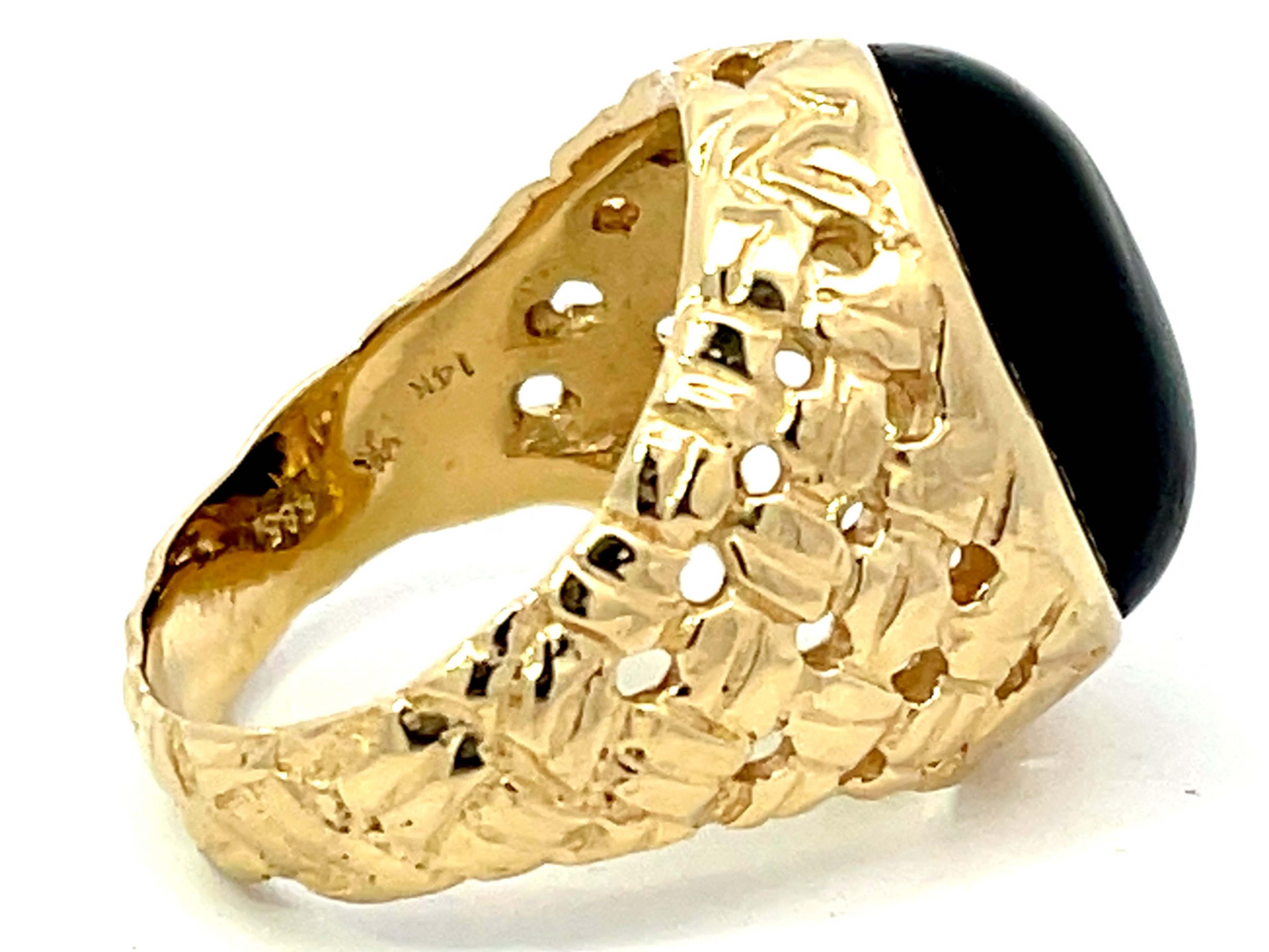 oval black onyx ring in 14k yellow gold