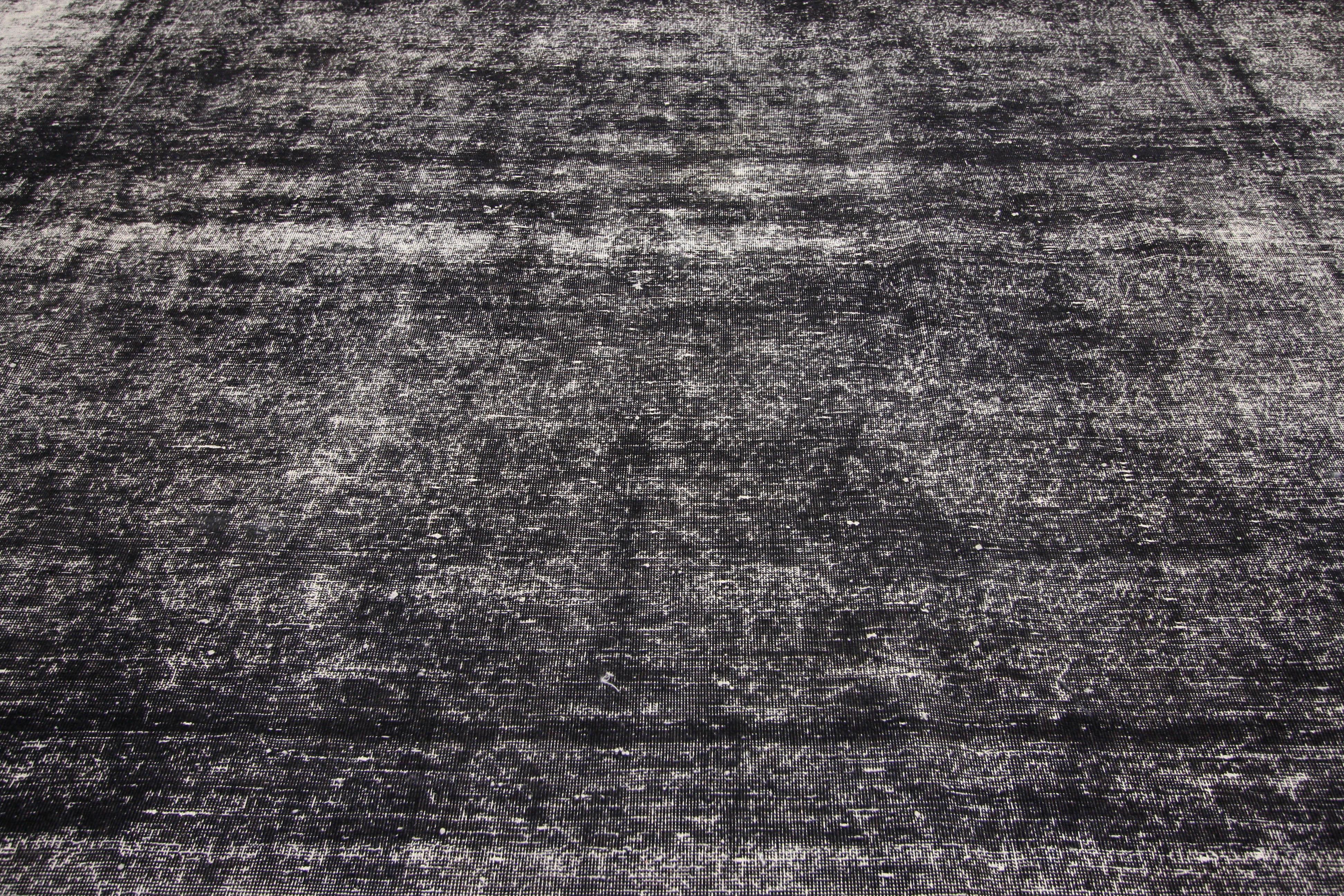 60693 Black Overdyed Distressed Vintage Turkish Rug with Modern Industrial Luxe Style. Defined and raw combined with utilitarian luxe appeal, this distressed overdyed vintage Turkish rug goes beyond the boundaries of design with historical richness