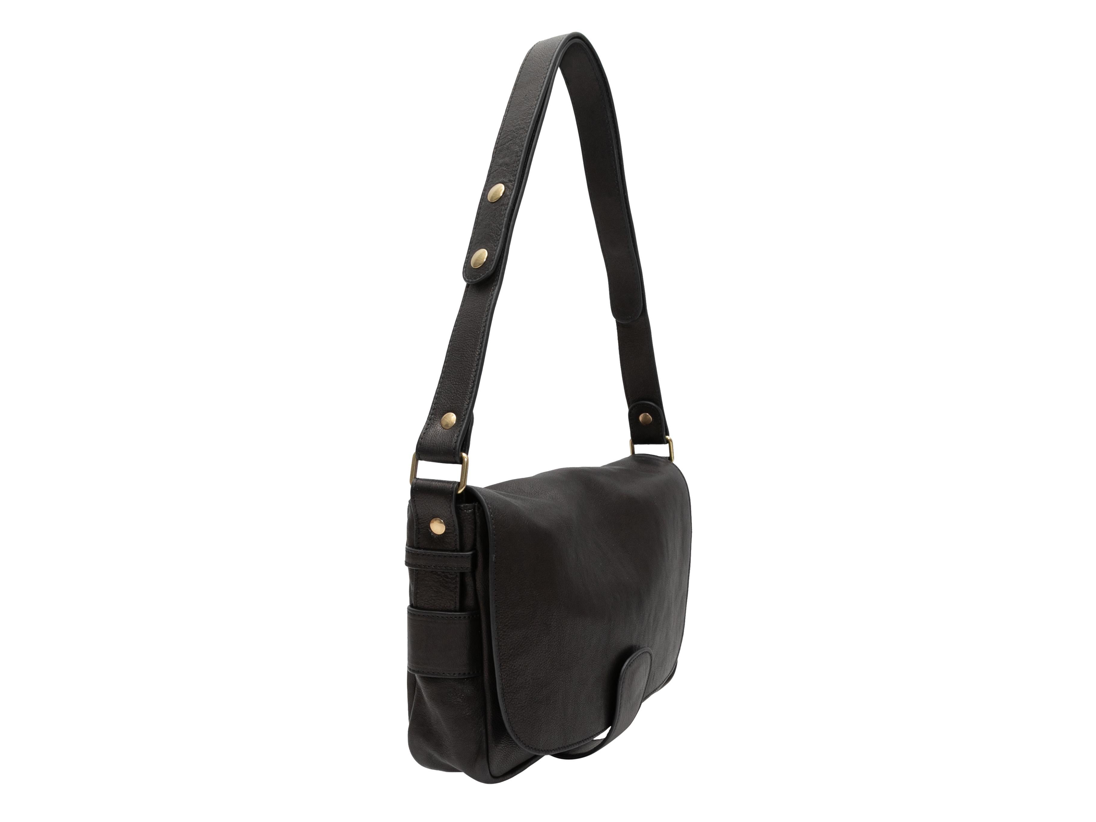 Black Pablo Paris Leather Shoulder Bag. This shoulder bag features a leather body, gold-tone hardware, a single flat shoulder strap, and a front closure. 11
