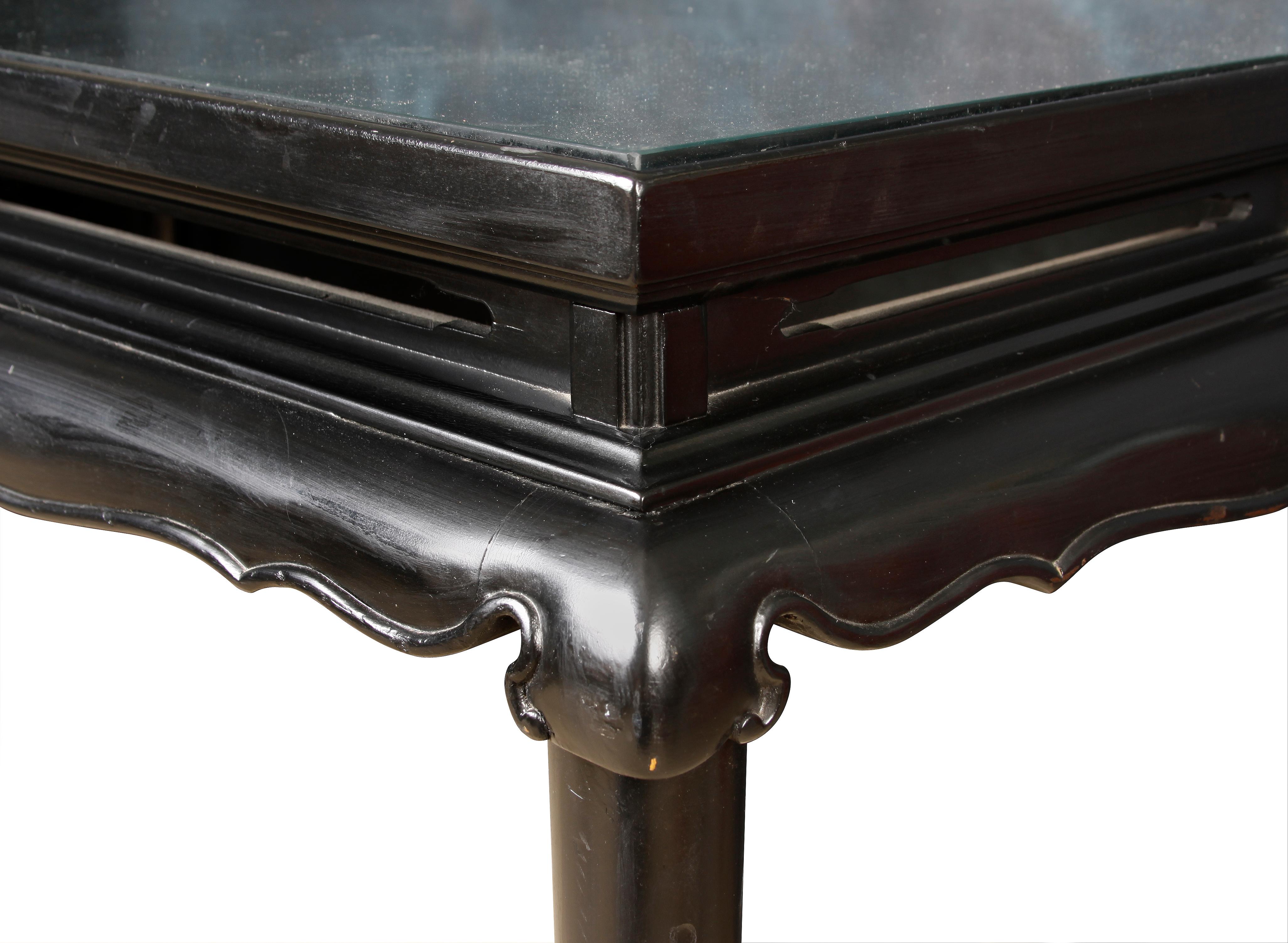 Black painted Asian Style console with glass top.