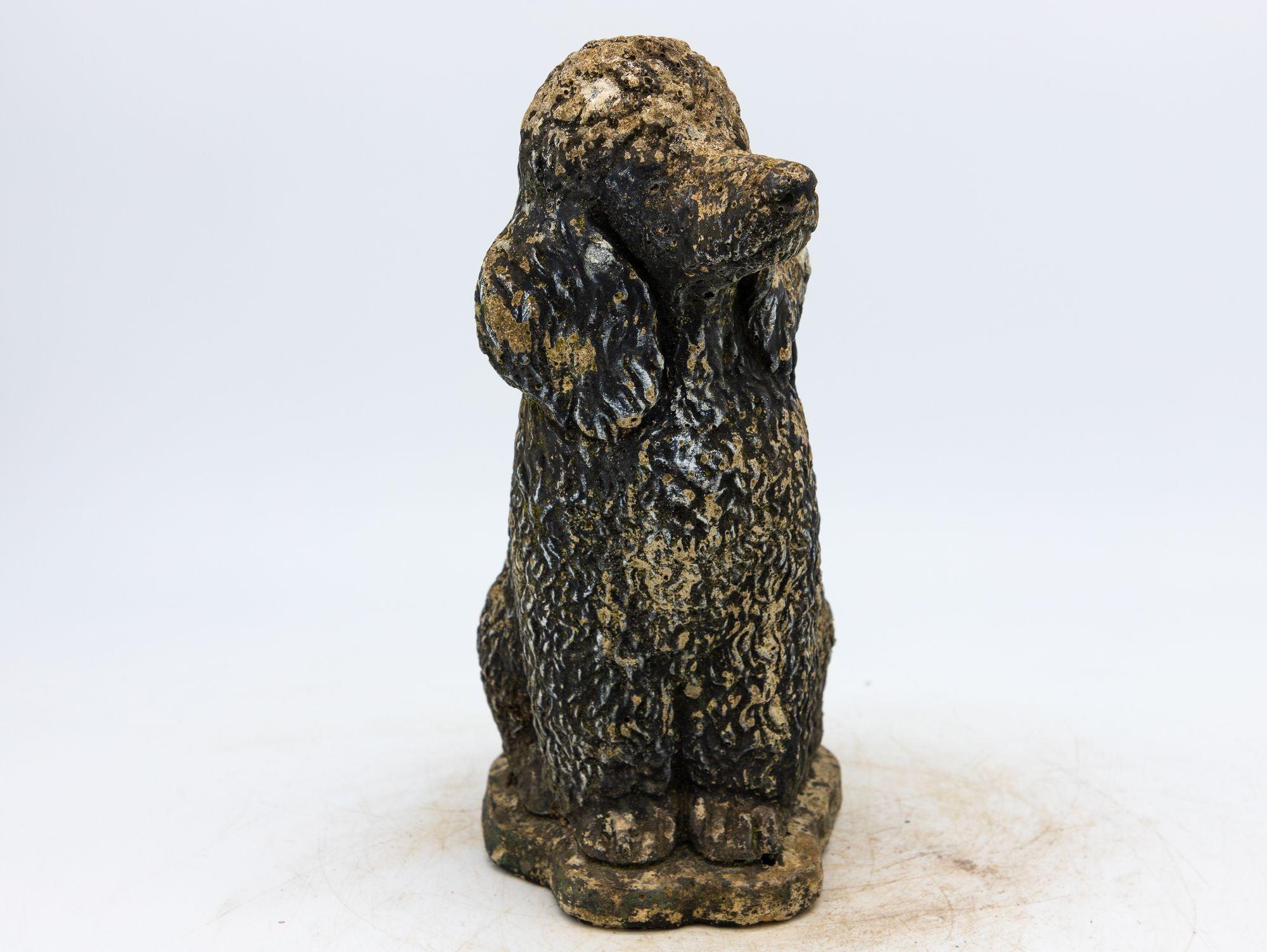 This heartwarming mid-20th century concrete dog black poodle garden ornament exudes an authentic vintage charm that adds a touch of personality to any outdoor space. This delightful figure, skillfully crafted from resilient concrete, captures the