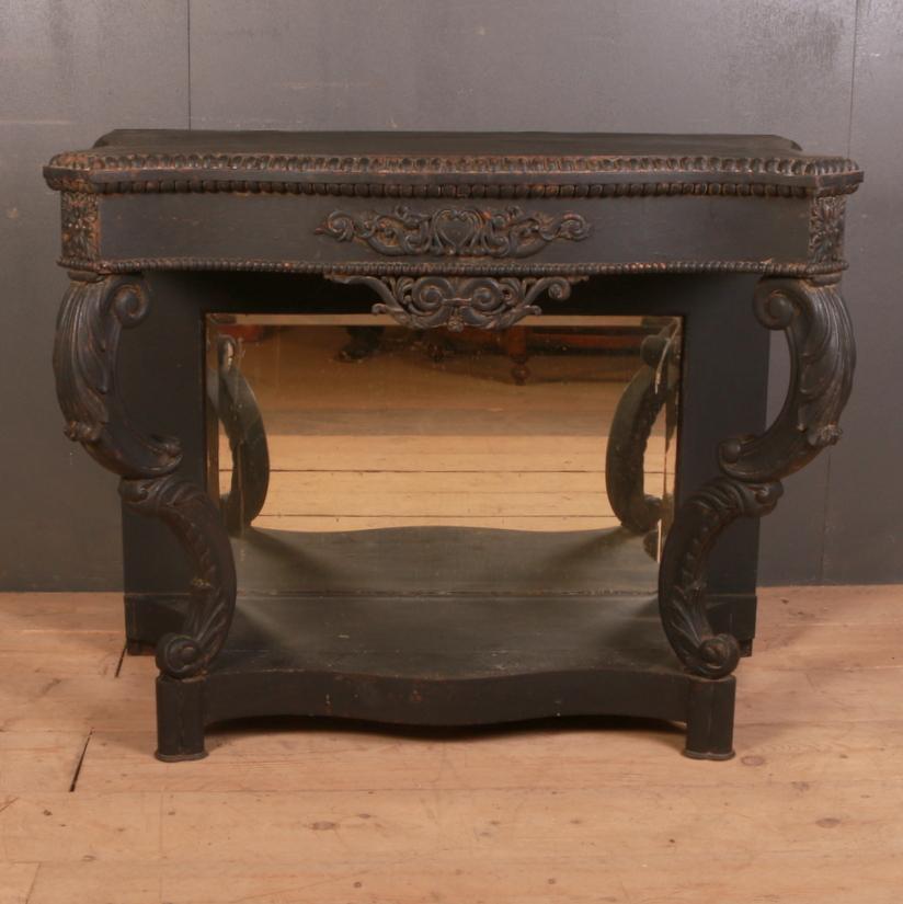 Good late 19th century English painted oak console table with a mirror back, 1850.

Dimensions:
44 inches (112 cms) wide
22.5 inches (57 cms) deep
36.5 inches (93 cms) high.

 