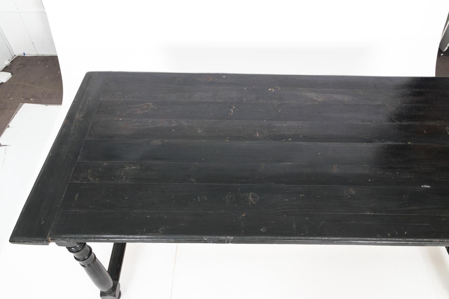 Black painted French country dining table with long H-shaped stretcher base and ring turned legs, circa 1870. Could also be used as a large flat top desk. Please note that this table has surface wear and scratches with age along with minor table