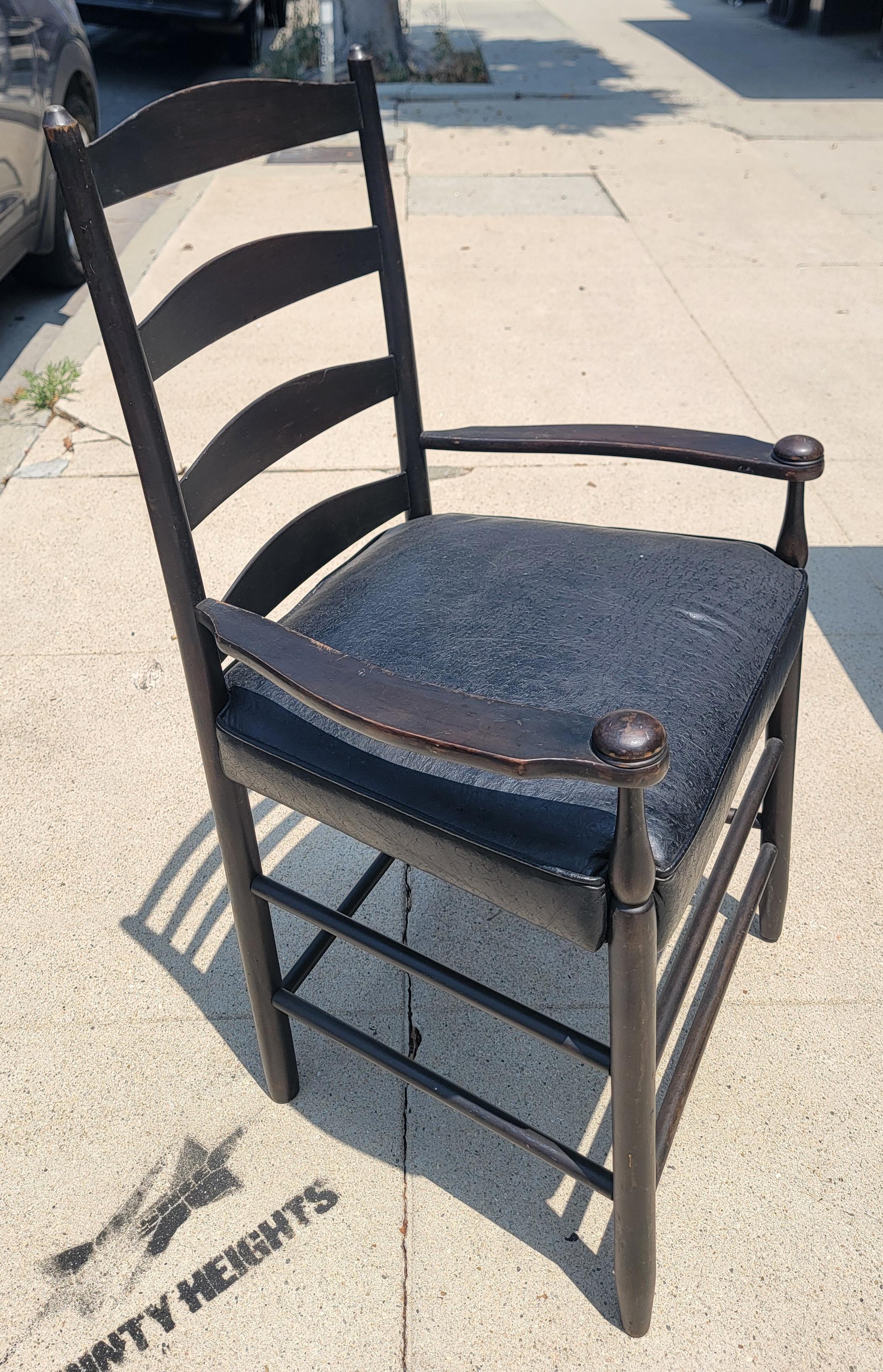 This fine black painted pine gaming table is in fine condition and would also make a great kitchen or dinning table for a small dining area. The chairs are a fine shaker style ladder back chairs with black leather seats.Chairs are super comfortable