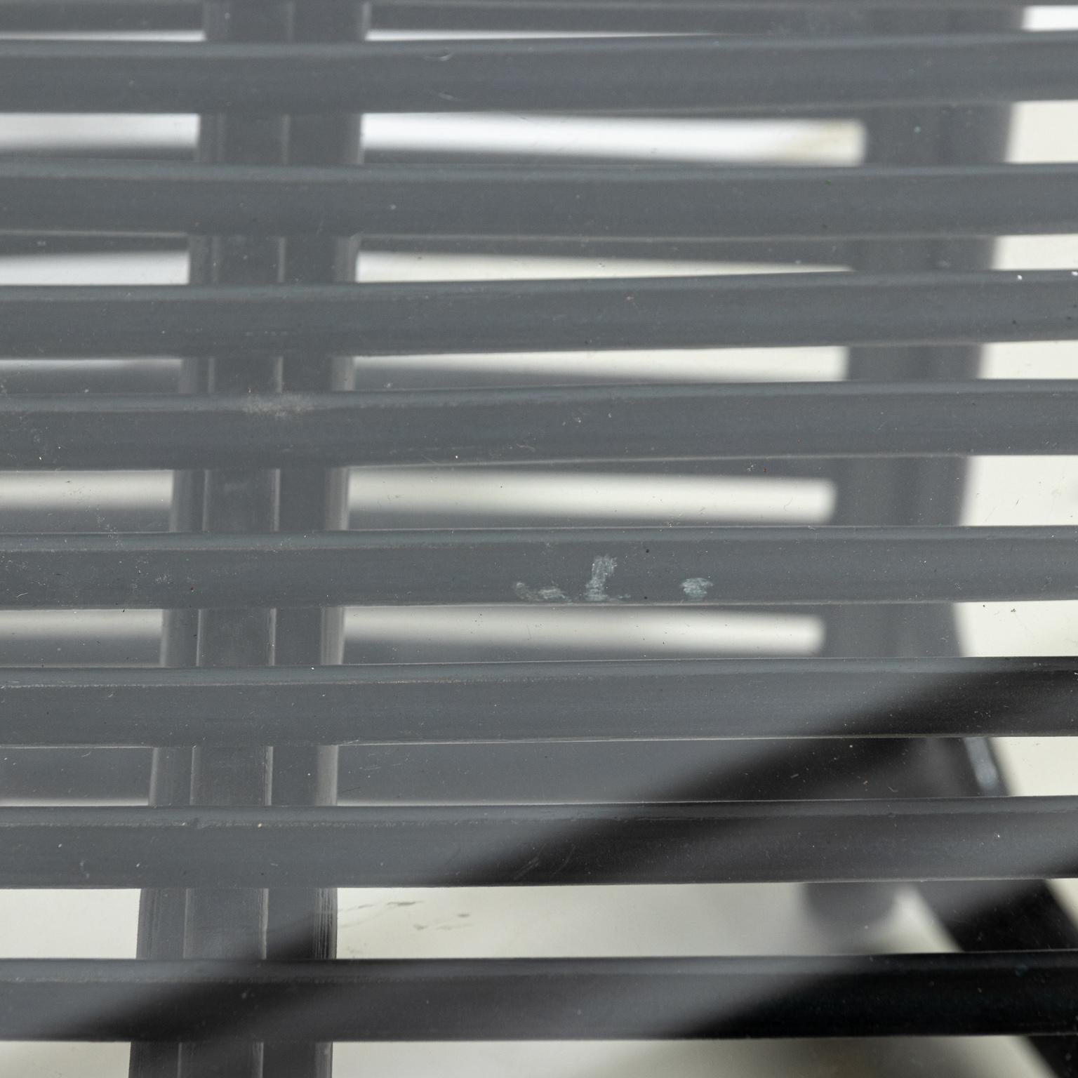 Black painted hexagonal side table with glass top. Please note of wear consistent with age including paint loss and minor losses to the rattan due to daily use.