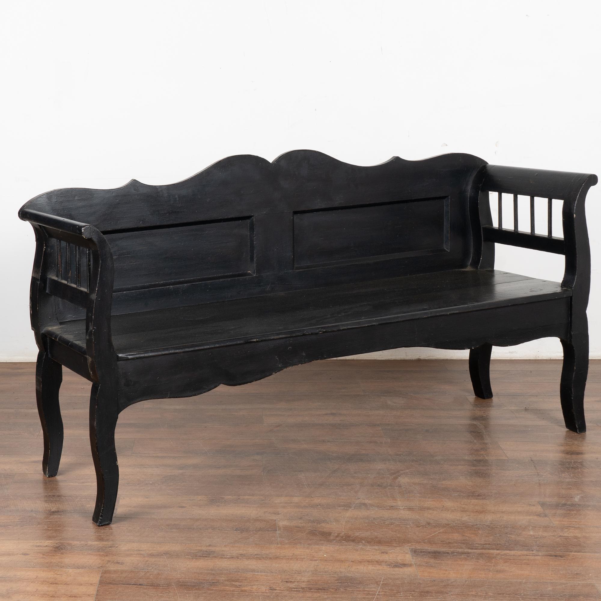 This delightful pine bench reminds one of a warm summer day in the European countryside.
The black paint was added later and has been naturally worn and distressed in areas revealing the natural pine below, all adding to the character and of the