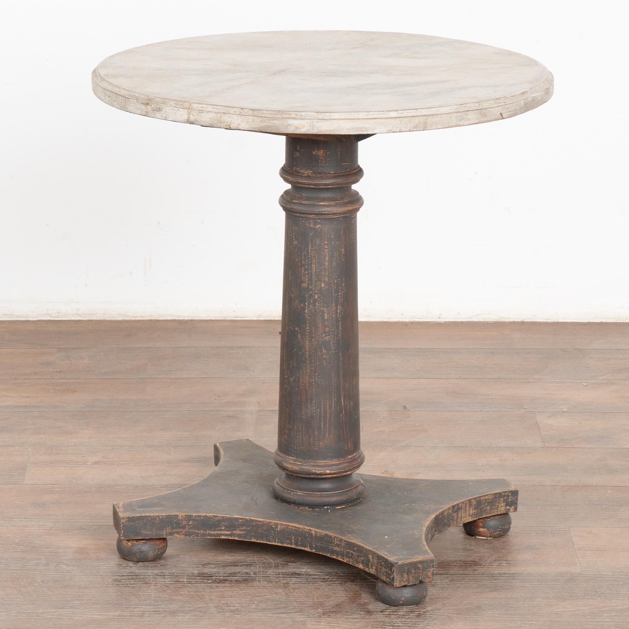 Striking side table with heavy turned and fluted pedestal base and 24