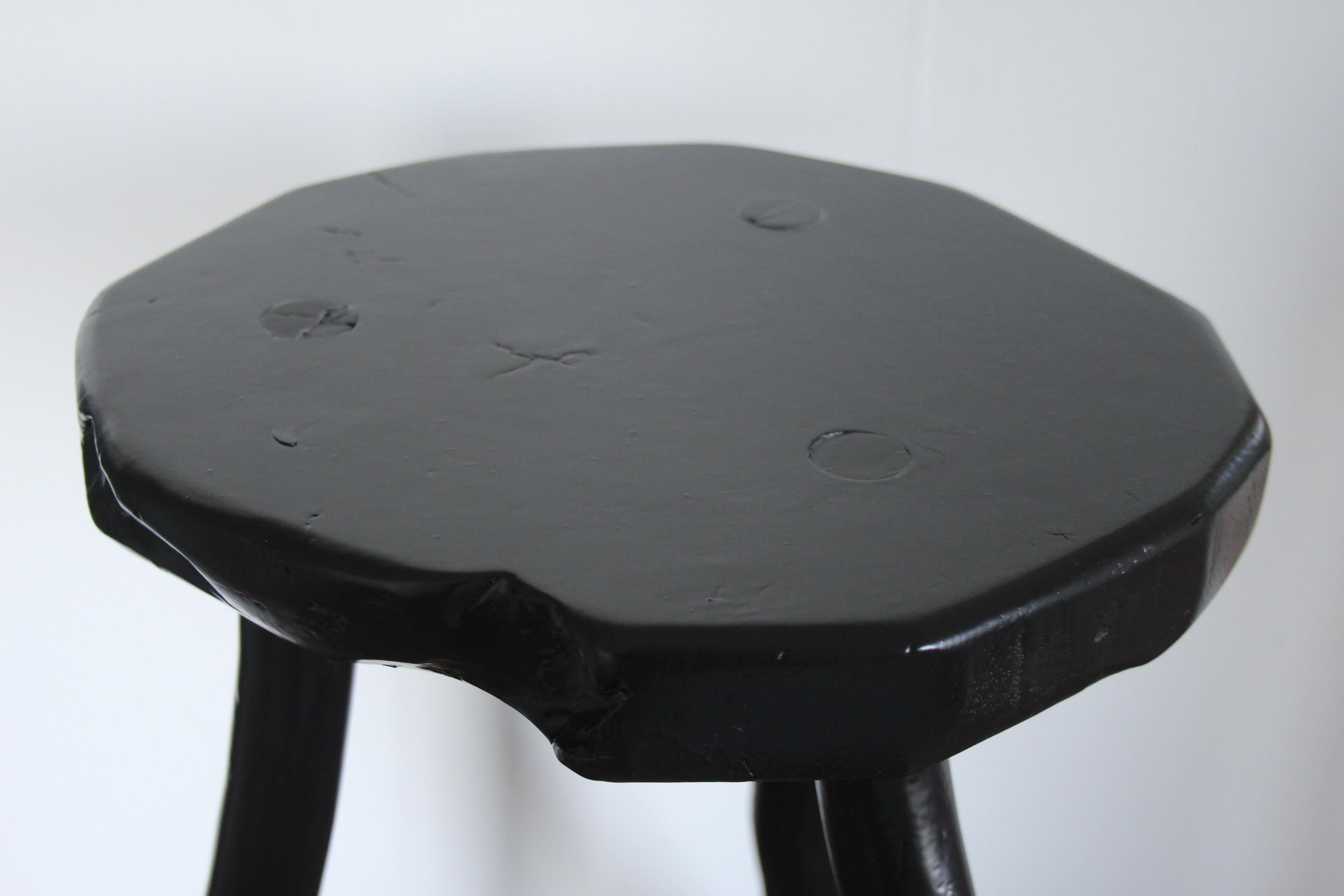 Black painted stool.