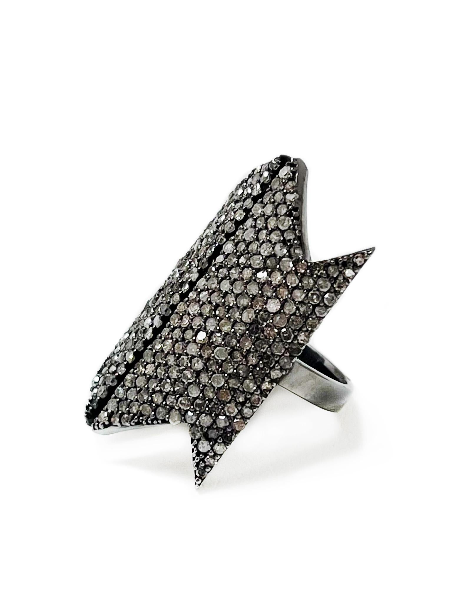 Intention: Extra fierce

Dorian's Find: Another fabulous vintage find, this geometric diamond pavé ring will have heads turning. We love its symmetry, and the floating effect the space down the center of the ring has. Blackened silver gives it an