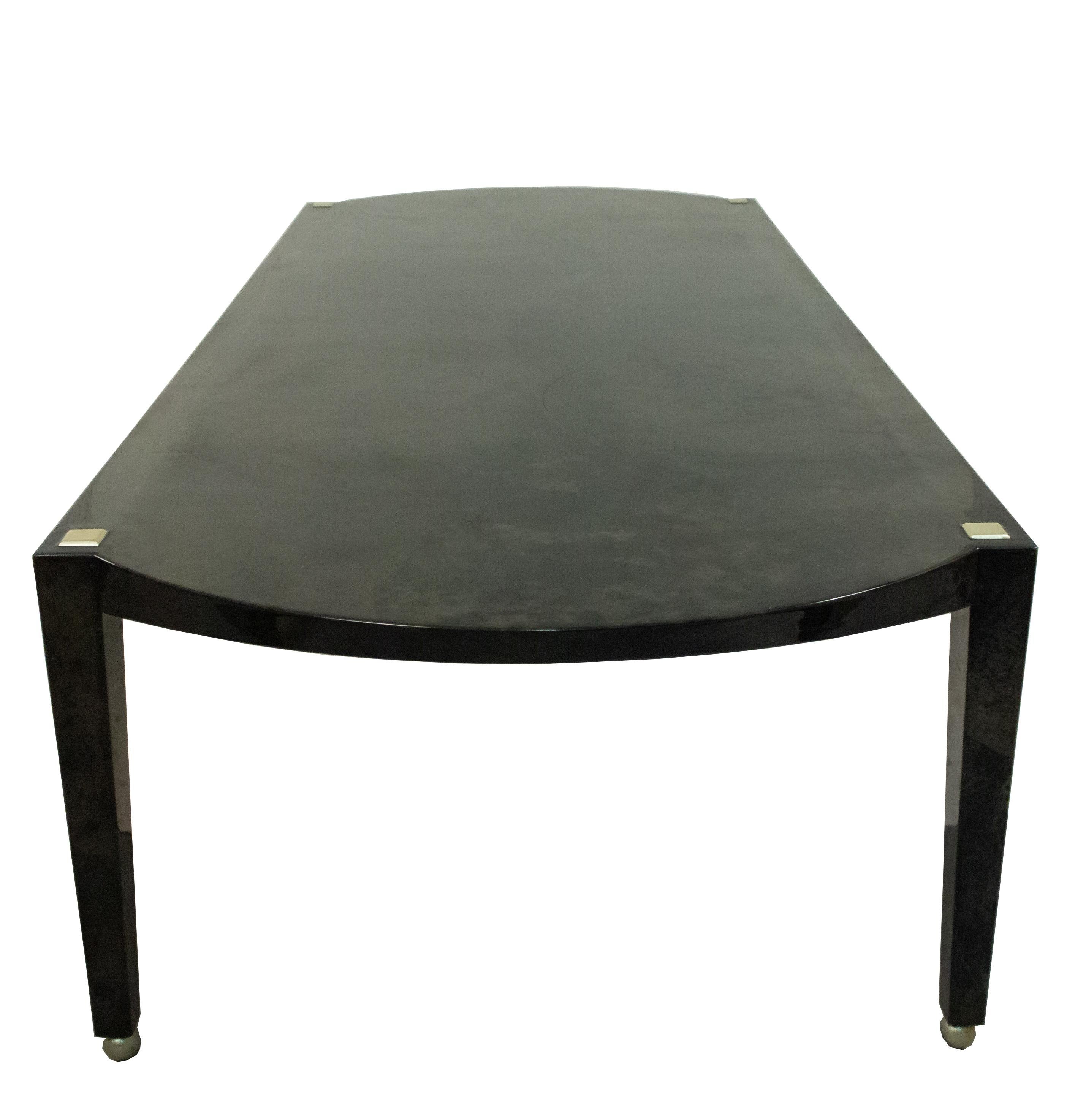 Italian midcentury (1970s-1980s) dark grey parchment and silver leaf trim dining table with rounded ends and supported on 4 black tapered legs.