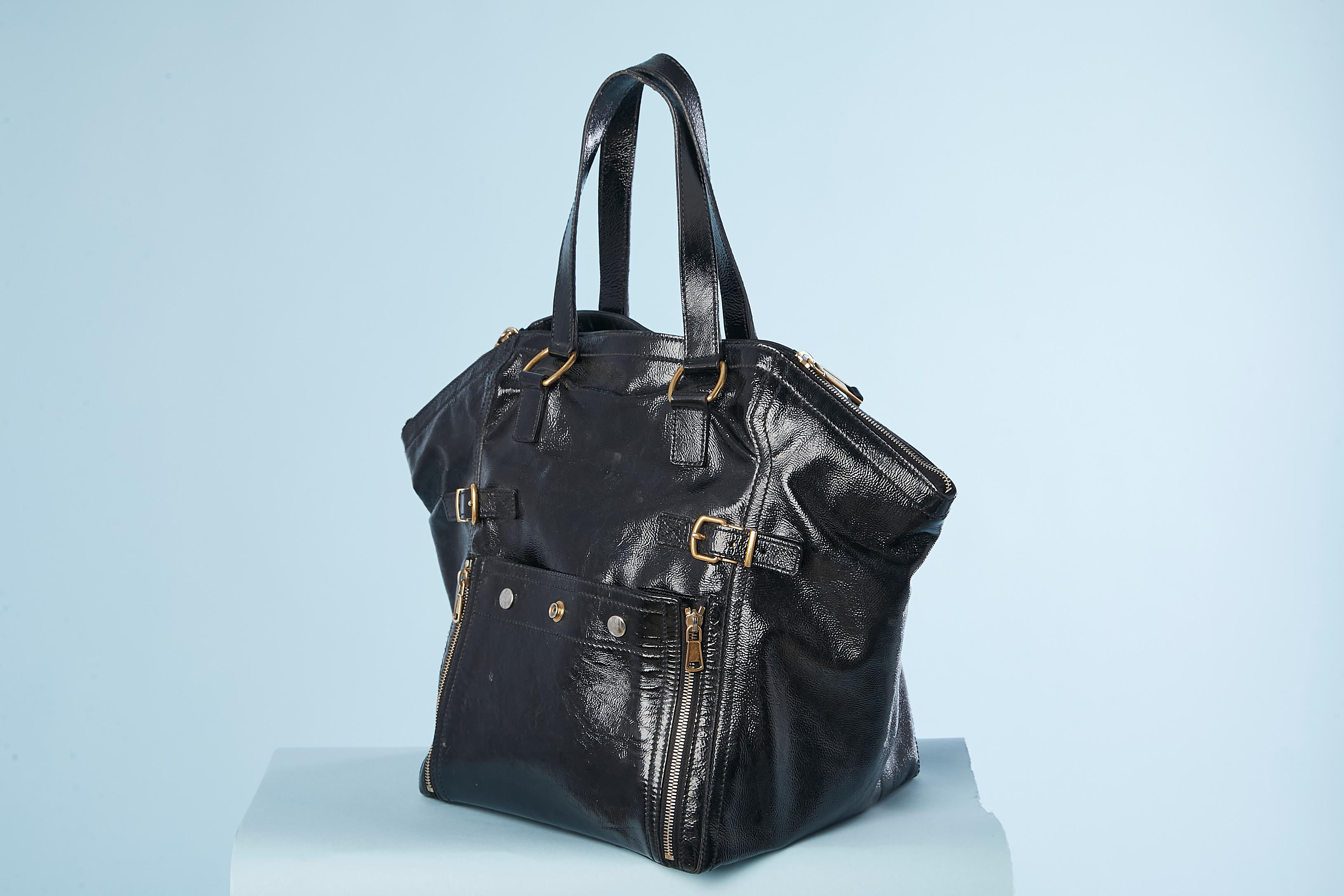 Black pattern leather Downtown Bag. Pocket with zip, buckles and snap on both side. Pocket with zip inside. 
Black suede and satin lining. 
Zip on both side on the top edge of the bag. 
Dust bag provided. 
size : height: 34 cm, width: 40 cm 
depth: