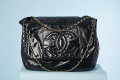 Black patent leather jumbo shoulder bag with Double C Chanel Numbered
