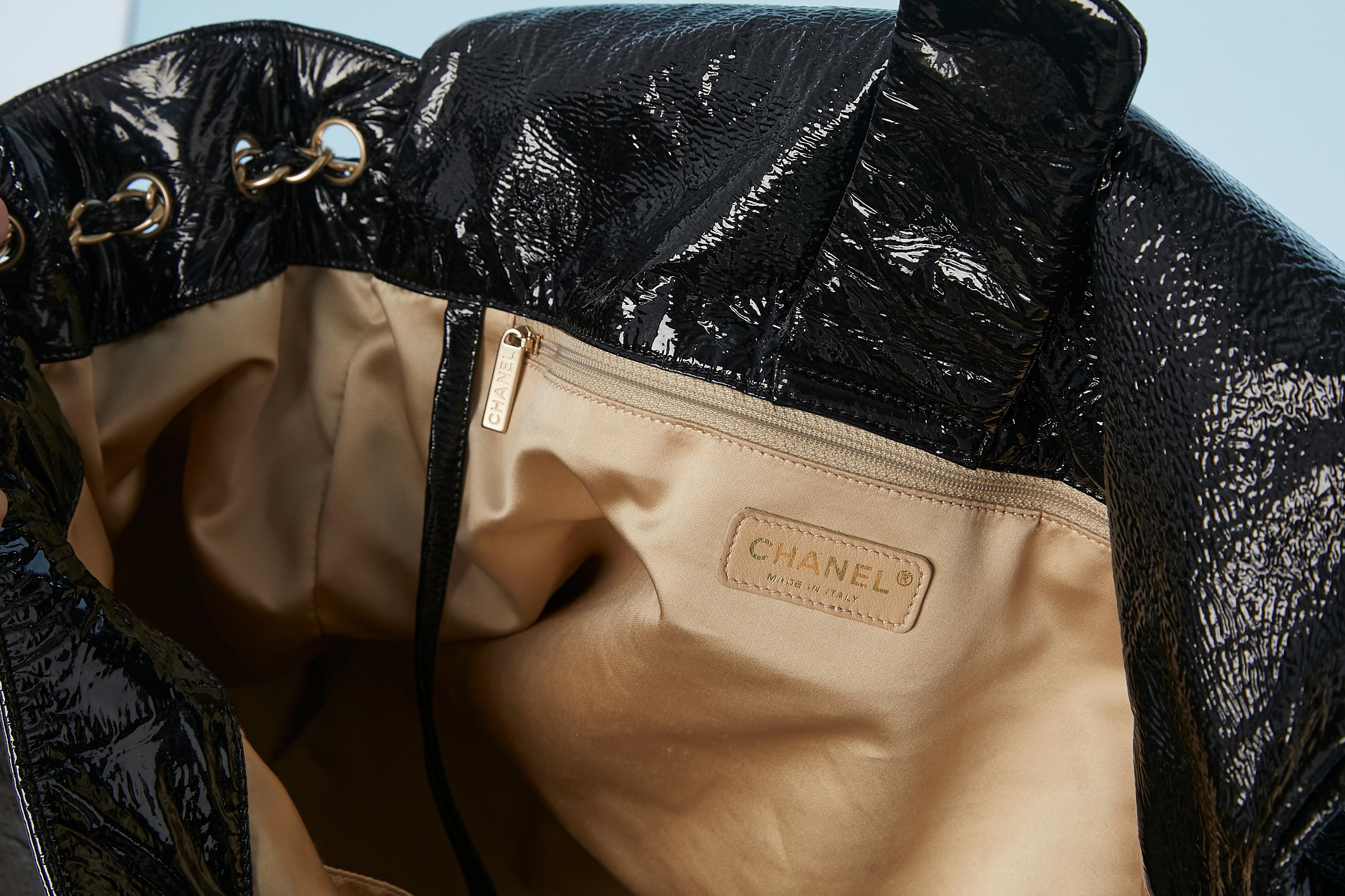 Black patent leather jumbo shoulder bag with Double C Chanel Numbered 5