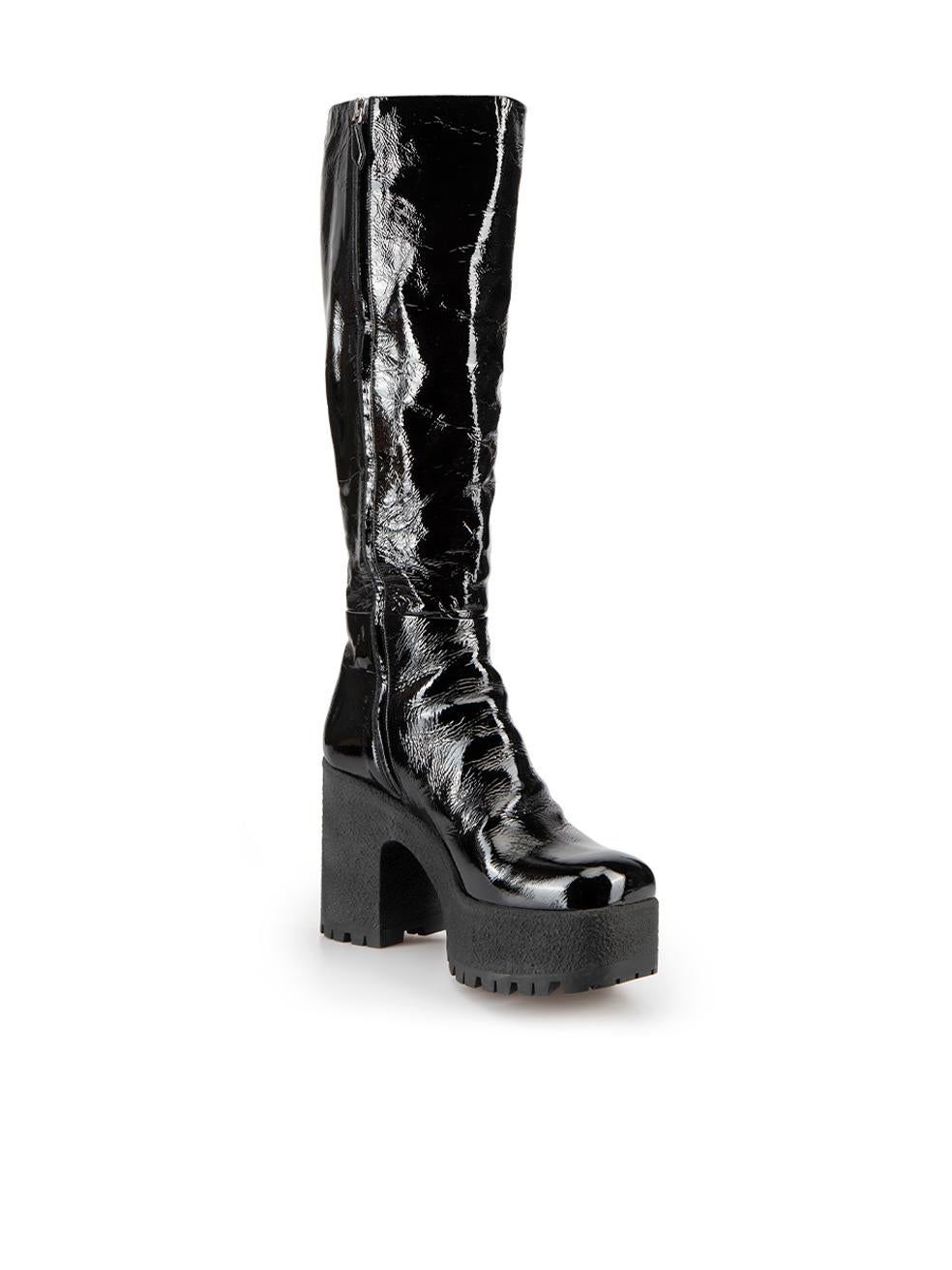 CONDITION is Very good. Minimal wear to boots is evident. Minimal wear to the rubber platform with white marks on this used Miu Miu designer resale item. 



Details


Black

Patent leather

Knee high boots

Square toe

Platform high heel

Side zip