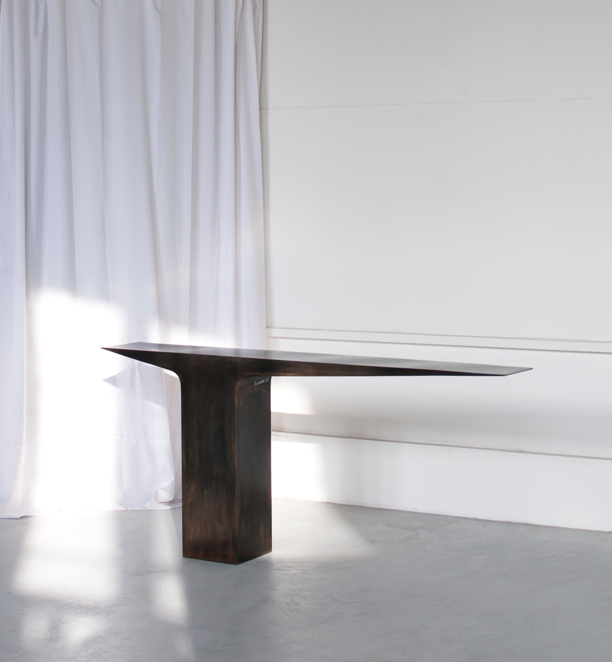 Black Patina Blade Console by Pol Quadens 
Limited Edition Of 8+4 Pieces.
Dimensions: D 30 x W 210 x H 95 cm.
Materials: Patinated steel.

Pol Quadens was born in Brussels. His father was active in the fields of composites the metal industry, and