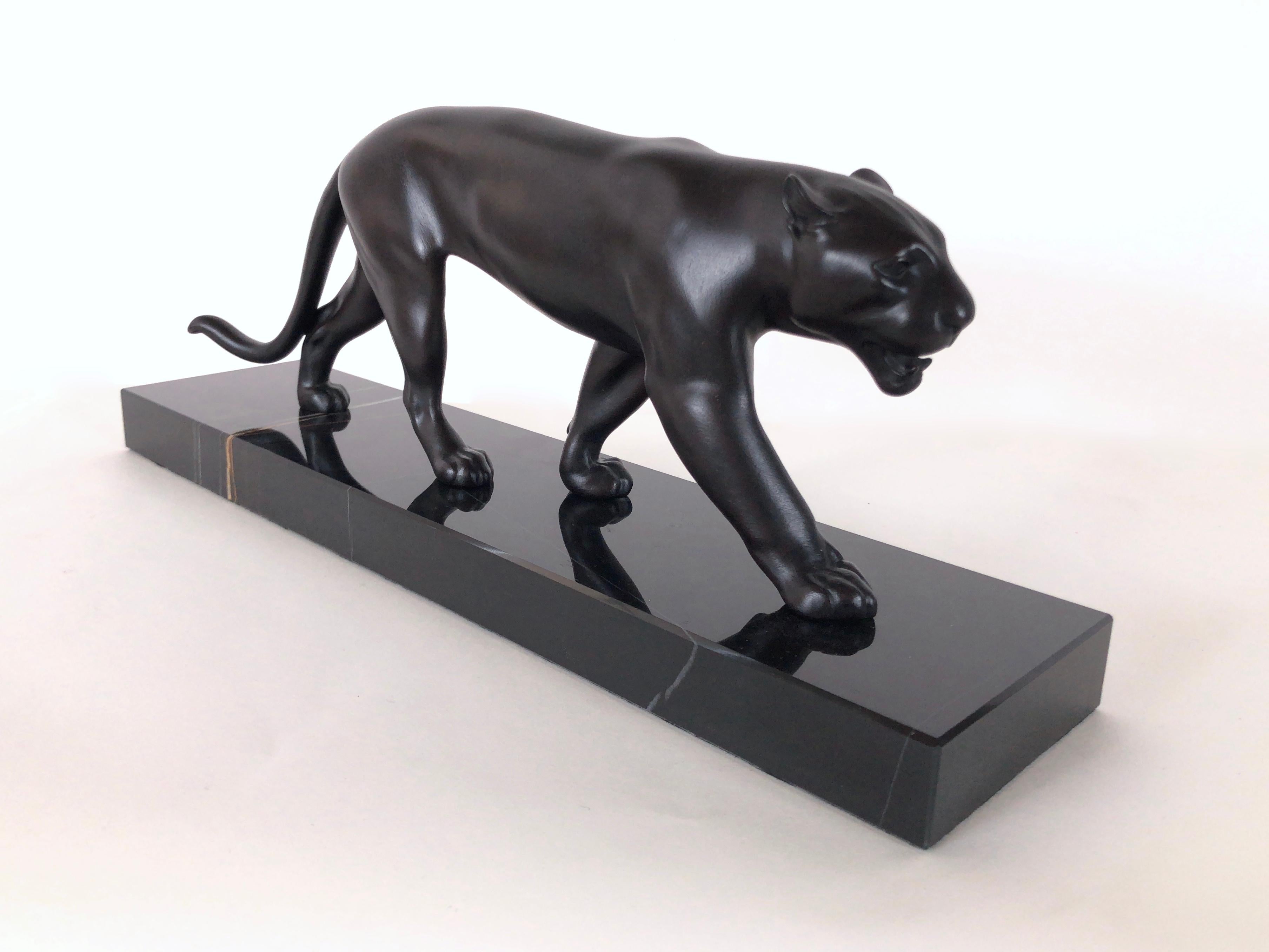 Lion / panther sculpture named “Ouganda”
Original “Max Le Verrier”, signed
Designed in France during the roaring 1920s by “Max Le Verrier” (1891-1973)
Art Deco style, France 

Sculpture made in “Régule” (spelter) 
Socle in black marble (could